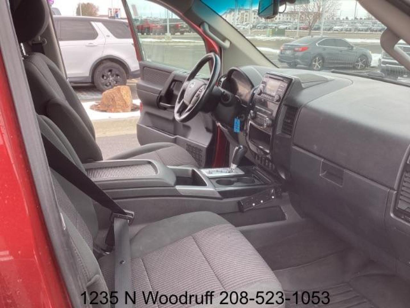 2014 Cayenne Red Metallic /Charcoal Nissan Titan SL Crew Cab 4WD (1N6AA0EC1EN) with an 5.6L V8 DOHC 32V engine, 5-Speed Automatic transmission, located at 1235 N Woodruff Ave., Idaho Falls, 83401, (208) 523-1053, 43.507172, -112.000488 - At Timberline Auto, finding a great deal on your next vehicle is always easy! Our experienced sales staff's goal is to help find you the right vehicle at the right price! Our knowledgeable finance department has options for almost any credit score. We offer extended service contract options to prote - Photo#17