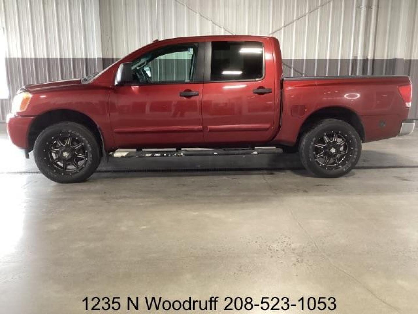 2014 Cayenne Red Metallic /Charcoal Nissan Titan SL Crew Cab 4WD (1N6AA0EC1EN) with an 5.6L V8 DOHC 32V engine, 5-Speed Automatic transmission, located at 1235 N Woodruff Ave., Idaho Falls, 83401, (208) 523-1053, 43.507172, -112.000488 - At Timberline Auto, finding a great deal on your next vehicle is always easy! Our experienced sales staff's goal is to help find you the right vehicle at the right price! Our knowledgeable finance department has options for almost any credit score. We offer extended service contract options to prote - Photo#1