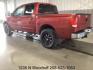 2014 Cayenne Red Metallic /Charcoal Nissan Titan SL Crew Cab 4WD (1N6AA0EC1EN) with an 5.6L V8 DOHC 32V engine, 5-Speed Automatic transmission, located at 1235 N Woodruff Ave., Idaho Falls, 83401, (208) 523-1053, 43.507172, -112.000488 - At Timberline Auto, finding a great deal on your next vehicle is always easy! Our experienced sales staff's goal is to help find you the right vehicle at the right price! Our knowledgeable finance department has options for almost any credit score. We offer extended service contract options to prote - Photo#2