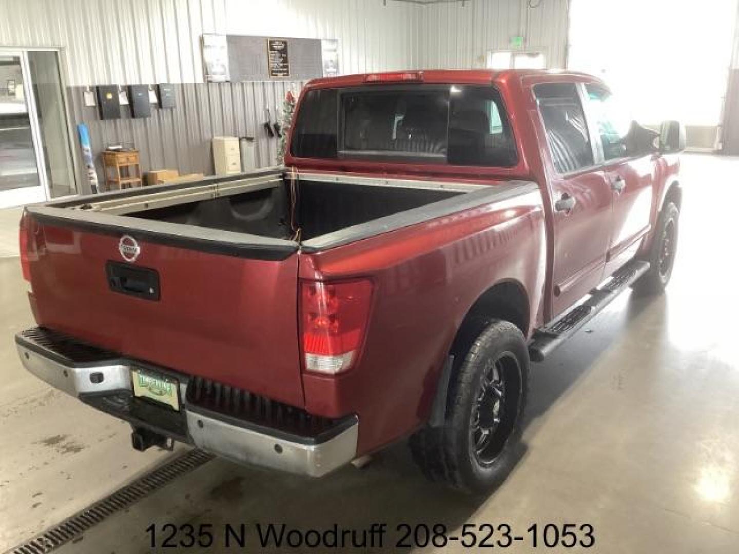 2014 Cayenne Red Metallic /Charcoal Nissan Titan SL Crew Cab 4WD (1N6AA0EC1EN) with an 5.6L V8 DOHC 32V engine, 5-Speed Automatic transmission, located at 1235 N Woodruff Ave., Idaho Falls, 83401, (208) 523-1053, 43.507172, -112.000488 - At Timberline Auto, finding a great deal on your next vehicle is always easy! Our experienced sales staff's goal is to help find you the right vehicle at the right price! Our knowledgeable finance department has options for almost any credit score. We offer extended service contract options to prote - Photo#4