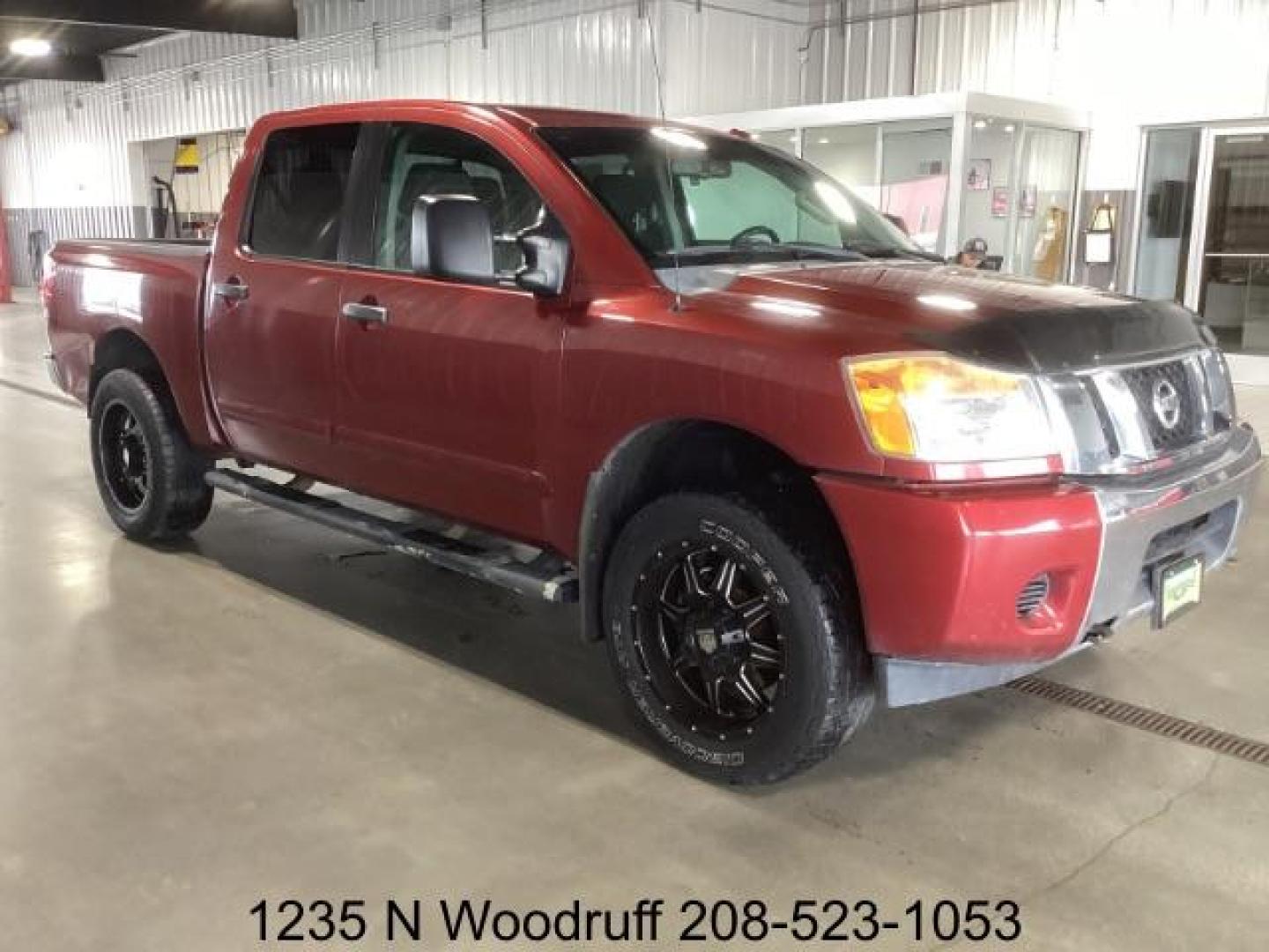 2014 Cayenne Red Metallic /Charcoal Nissan Titan SL Crew Cab 4WD (1N6AA0EC1EN) with an 5.6L V8 DOHC 32V engine, 5-Speed Automatic transmission, located at 1235 N Woodruff Ave., Idaho Falls, 83401, (208) 523-1053, 43.507172, -112.000488 - At Timberline Auto, finding a great deal on your next vehicle is always easy! Our experienced sales staff's goal is to help find you the right vehicle at the right price! Our knowledgeable finance department has options for almost any credit score. We offer extended service contract options to prote - Photo#5