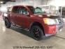 2014 Cayenne Red Metallic /Charcoal Nissan Titan SL Crew Cab 4WD (1N6AA0EC1EN) with an 5.6L V8 DOHC 32V engine, 5-Speed Automatic transmission, located at 1235 N Woodruff Ave., Idaho Falls, 83401, (208) 523-1053, 43.507172, -112.000488 - At Timberline Auto, finding a great deal on your next vehicle is always easy! Our experienced sales staff's goal is to help find you the right vehicle at the right price! Our knowledgeable finance department has options for almost any credit score. We offer extended service contract options to prote - Photo#5