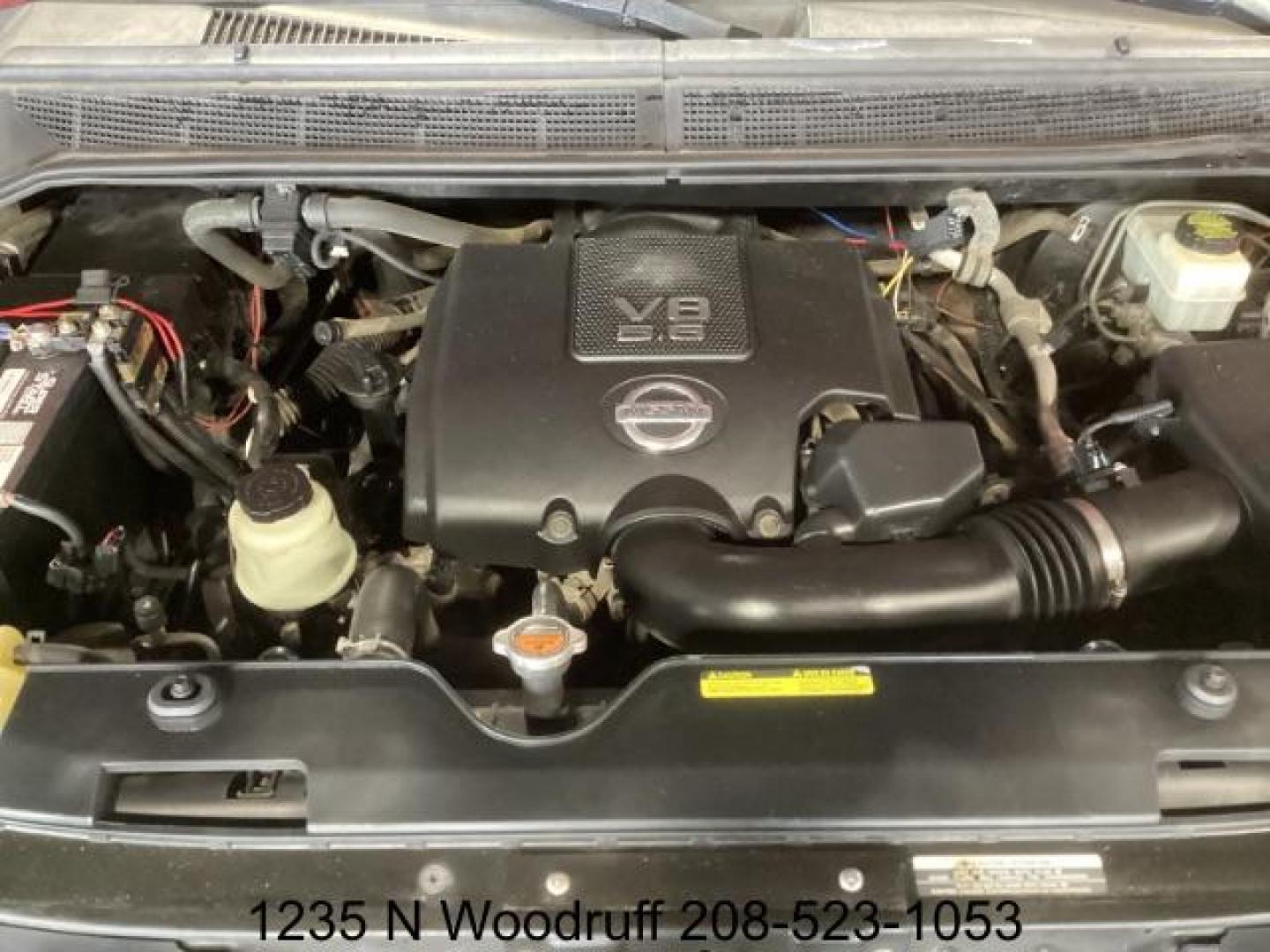 2014 Cayenne Red Metallic /Charcoal Nissan Titan SL Crew Cab 4WD (1N6AA0EC1EN) with an 5.6L V8 DOHC 32V engine, 5-Speed Automatic transmission, located at 1235 N Woodruff Ave., Idaho Falls, 83401, (208) 523-1053, 43.507172, -112.000488 - At Timberline Auto, finding a great deal on your next vehicle is always easy! Our experienced sales staff's goal is to help find you the right vehicle at the right price! Our knowledgeable finance department has options for almost any credit score. We offer extended service contract options to prote - Photo#7