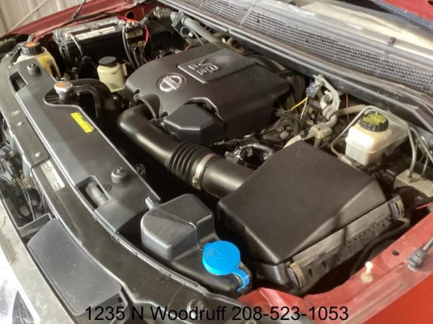 2014 Cayenne Red Metallic /Charcoal Nissan Titan SL Crew Cab 4WD (1N6AA0EC1EN) with an 5.6L V8 DOHC 32V engine, 5-Speed Automatic transmission, located at 1235 N Woodruff Ave., Idaho Falls, 83401, (208) 523-1053, 43.507172, -112.000488 - At Timberline Auto, finding a great deal on your next vehicle is always easy! Our experienced sales staff's goal is to help find you the right vehicle at the right price! Our knowledgeable finance department has options for almost any credit score. We offer extended service contract options to prote - Photo#8