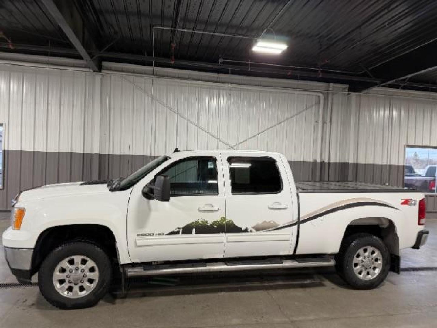 2012 Summit White /Ebony Leather Interior GMC Sierra 2500HD SLT Crew Cab 4WD (1GT121E8XCF) with an 6.6L V8 OHV 32V TURBO DIESEL engine, 6-Speed Automatic transmission, located at 1235 N Woodruff Ave., Idaho Falls, 83401, (208) 523-1053, 43.507172, -112.000488 - At Timberline Auto, finding a great deal on your next vehicle is always easy! Our experienced sales staff's goal is to help find you the right vehicle at the right price! Our knowledgeable finance department has options for almost any credit score. We offer extended service contract options to prote - Photo#1