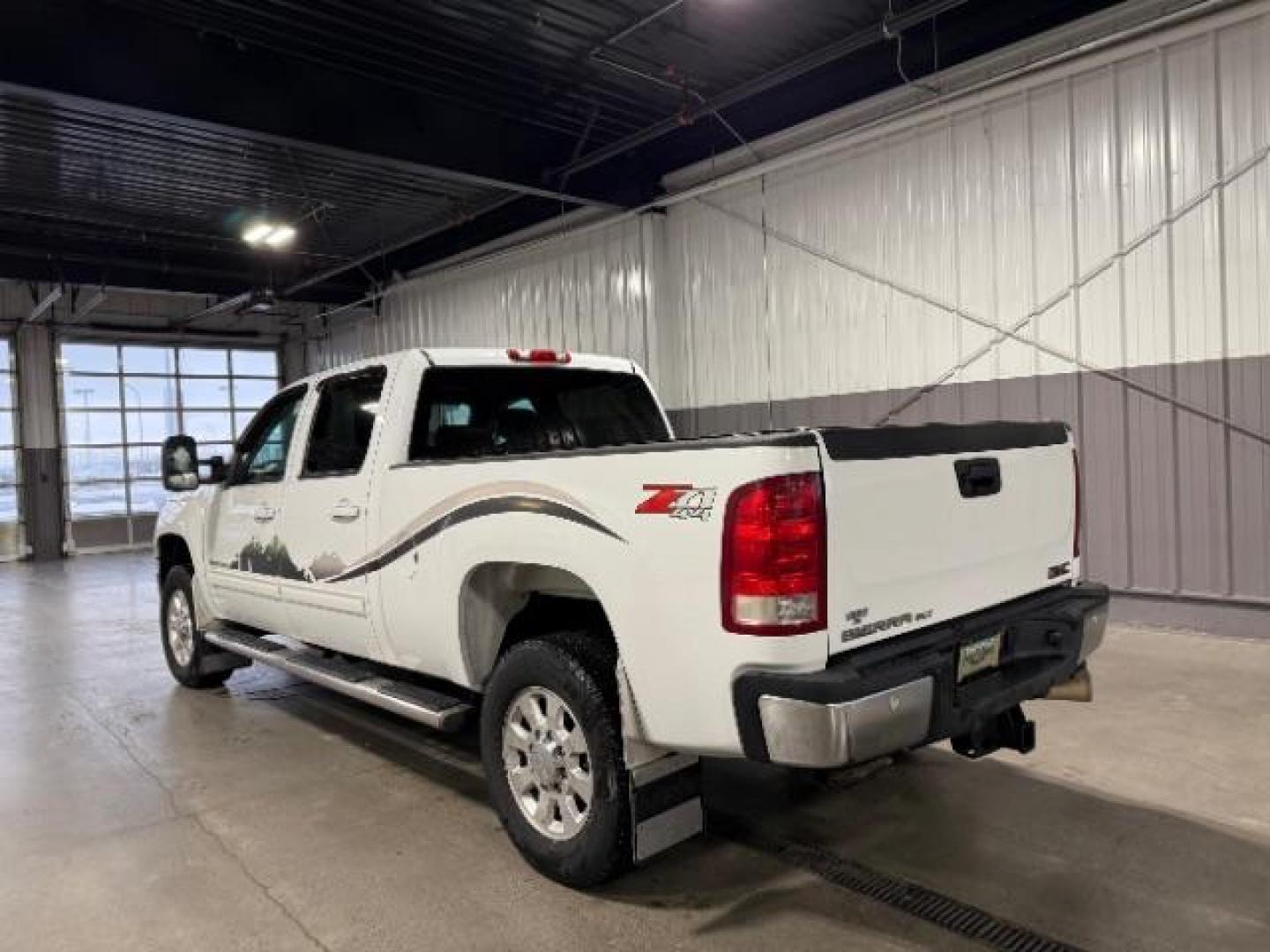 2012 Summit White /Ebony Leather Interior GMC Sierra 2500HD SLT Crew Cab 4WD (1GT121E8XCF) with an 6.6L V8 OHV 32V TURBO DIESEL engine, 6-Speed Automatic transmission, located at 1235 N Woodruff Ave., Idaho Falls, 83401, (208) 523-1053, 43.507172, -112.000488 - At Timberline Auto, finding a great deal on your next vehicle is always easy! Our experienced sales staff's goal is to help find you the right vehicle at the right price! Our knowledgeable finance department has options for almost any credit score. We offer extended service contract options to prote - Photo#2