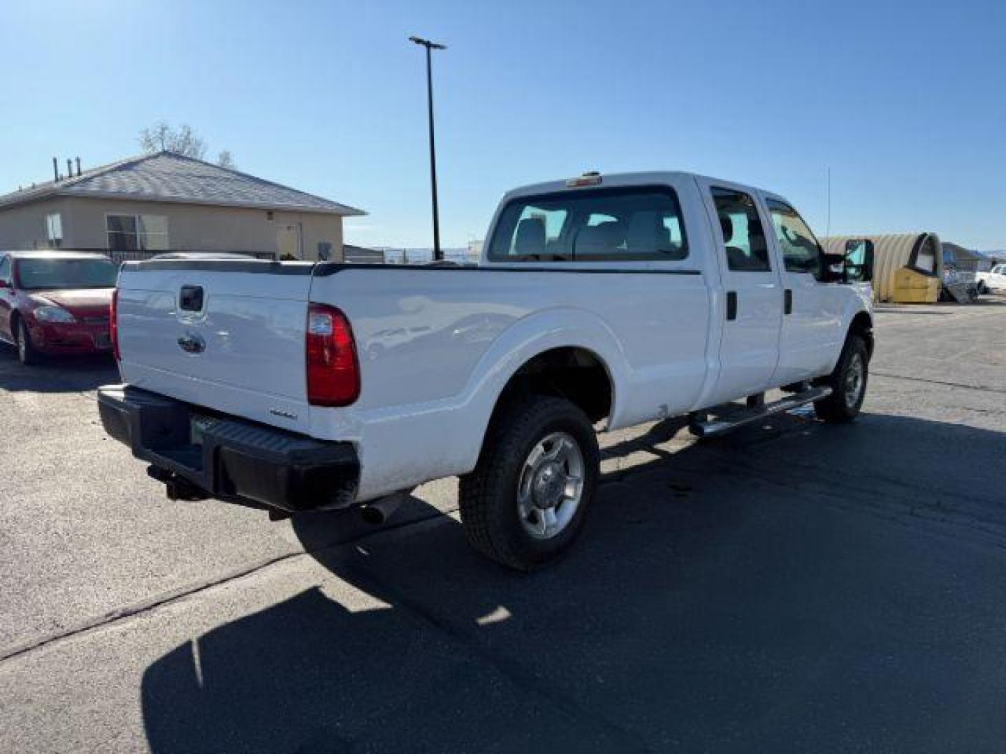 2012 Oxford White /Steel Cloth Interior Ford F-250 SD XLT Crew Cab Long Bed 4WD (1FT7W2B63CE) with an 6.2L V8 OHV 16V engine, 6-Speed Automatic transmission, located at 1235 N Woodruff Ave., Idaho Falls, 83401, (208) 523-1053, 43.507172, -112.000488 - At Timberline Auto, finding a great deal on your next vehicle is always easy! Our experienced sales staff's goal is to help find you the right vehicle at the right price! Our knowledgeable finance department has options for almost any credit score. We offer extended service contract options to prote - Photo#4