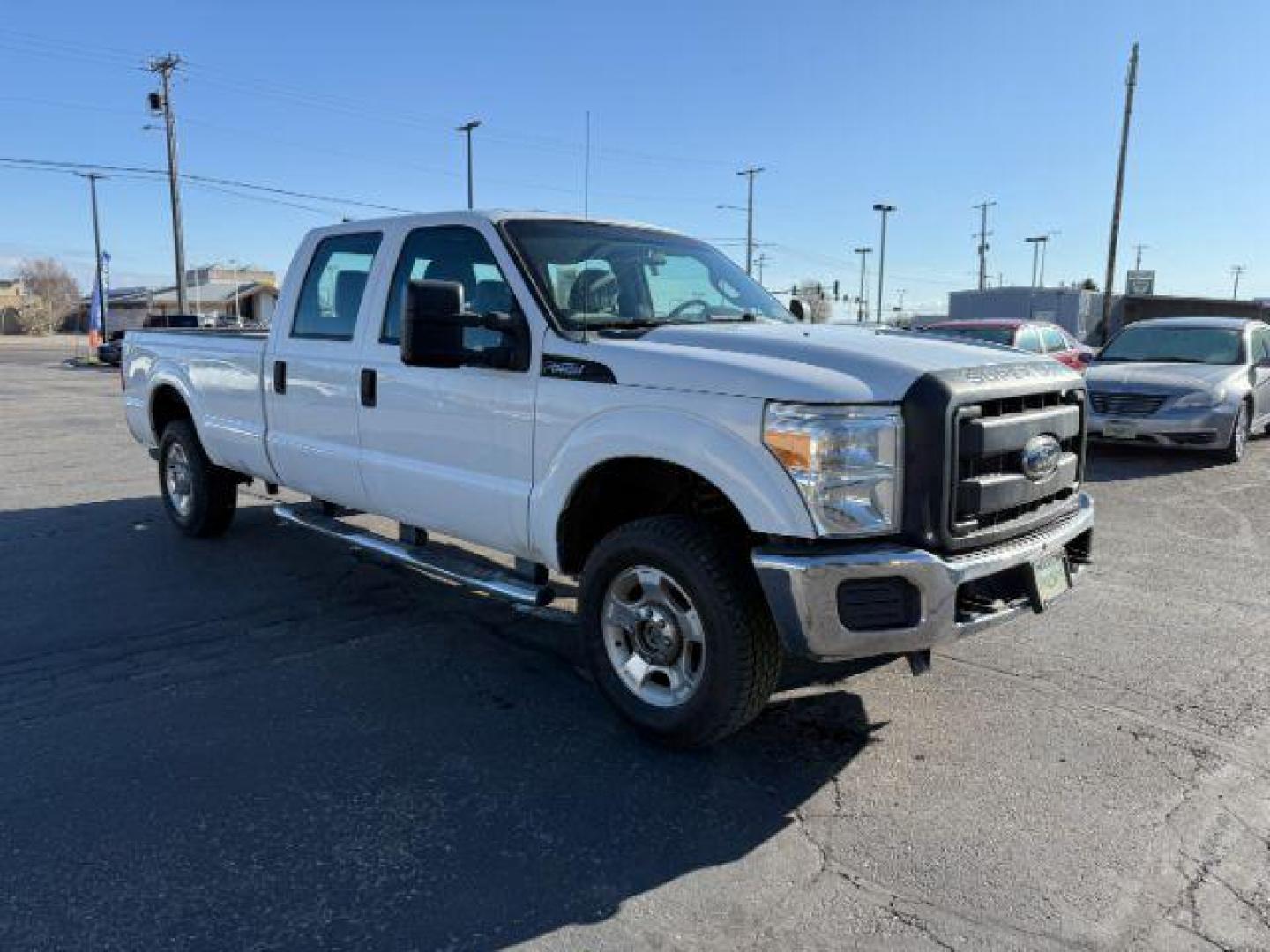 2012 Oxford White /Steel Cloth Interior Ford F-250 SD XLT Crew Cab Long Bed 4WD (1FT7W2B63CE) with an 6.2L V8 OHV 16V engine, 6-Speed Automatic transmission, located at 1235 N Woodruff Ave., Idaho Falls, 83401, (208) 523-1053, 43.507172, -112.000488 - At Timberline Auto, finding a great deal on your next vehicle is always easy! Our experienced sales staff's goal is to help find you the right vehicle at the right price! Our knowledgeable finance department has options for almost any credit score. We offer extended service contract options to prote - Photo#5