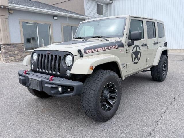 2018 TAN /Black, cloth Jeep Wrangler JK Unlimited Rubicon 4WD (1C4BJWFG4JL) with an 3.6L V6 DOHC 24V FFV engine, 6-Speed Automatic transmission, located at 1235 N Woodruff Ave., Idaho Falls, 83401, (208) 523-1053, 43.507172, -112.000488 - At Timberline Auto, finding a great deal on your next vehicle is always easy! Our experienced sales staff goal is to help find you the right vehicle at the right price! Our knowledgeable finance department has options for almost any credit score. We offer extended service contract options to prot- Photo#0