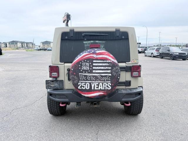 2018 TAN /Black, cloth Jeep Wrangler JK Unlimited Rubicon 4WD (1C4BJWFG4JL) with an 3.6L V6 DOHC 24V FFV engine, 6-Speed Automatic transmission, located at 1235 N Woodruff Ave., Idaho Falls, 83401, (208) 523-1053, 43.507172, -112.000488 - At Timberline Auto, finding a great deal on your next vehicle is always easy! Our experienced sales staff goal is to help find you the right vehicle at the right price! Our knowledgeable finance department has options for almost any credit score. We offer extended service contract options to prot- Photo#3