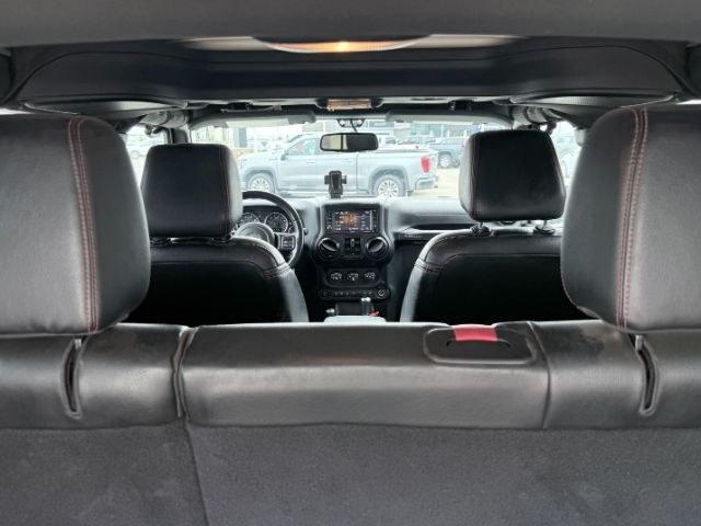 2018 TAN /Black, cloth Jeep Wrangler JK Unlimited Rubicon 4WD (1C4BJWFG4JL) with an 3.6L V6 DOHC 24V FFV engine, 6-Speed Automatic transmission, located at 1235 N Woodruff Ave., Idaho Falls, 83401, (208) 523-1053, 43.507172, -112.000488 - At Timberline Auto, finding a great deal on your next vehicle is always easy! Our experienced sales staff goal is to help find you the right vehicle at the right price! Our knowledgeable finance department has options for almost any credit score. We offer extended service contract options to prot- Photo#5