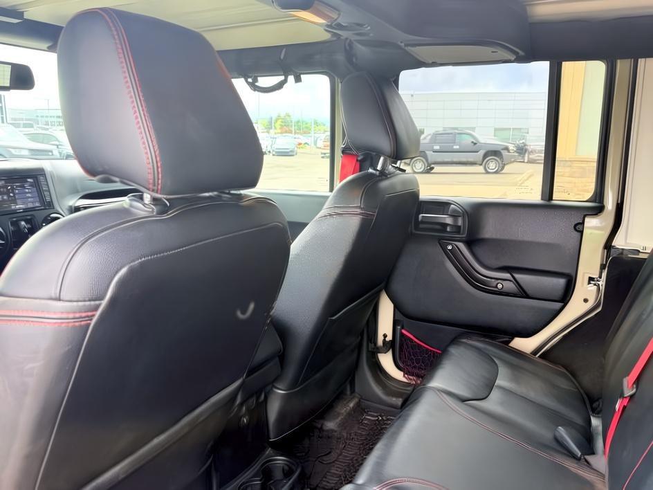 2018 TAN /Black Jeep Wrangler Rubicon (1C4BJWFG4JL) with an V6, 3.6L engine, 6-speed manual transmission, located at 1175 N Woodruff Ave, Idaho Falls, ID, 83401, 43.506901, -111.999657 - <b>Vehicle Details</b><br>Adventure-ready and built to conquer, this 2018 Jeep Wrangler Unlimited Rubicon in Idaho Falls, ID delivers legendary off-road capability with rugged style and everyday comfort. Powered by a strong V6, 3.6L gasoline engine and equipped with 4WD, this Jeep Wrangler is engine- Photo#51