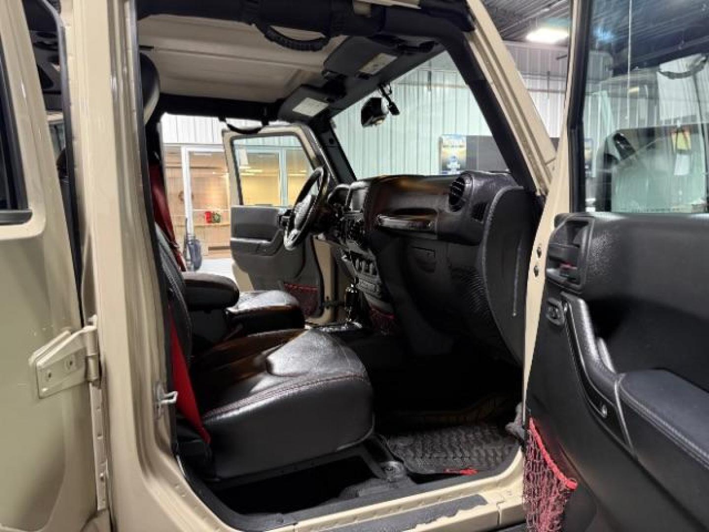 2018 TAN /Black, leather Jeep Wrangler JK Unlimited Rubicon 4WD (1C4BJWFG4JL) with an 3.6L V6 DOHC 24V FFV engine, 6-Speed Automatic transmission, located at 1235 N Woodruff Ave., Idaho Falls, 83401, (208) 523-1053, 43.507172, -112.000488 - At Timberline Auto, finding a great deal on your next vehicle is always easy! Our experienced sales staff's goal is to help find you the right vehicle at the right price! Our knowledgeable finance department has options for almost any credit score. We offer extended service contract options to prote - Photo#12