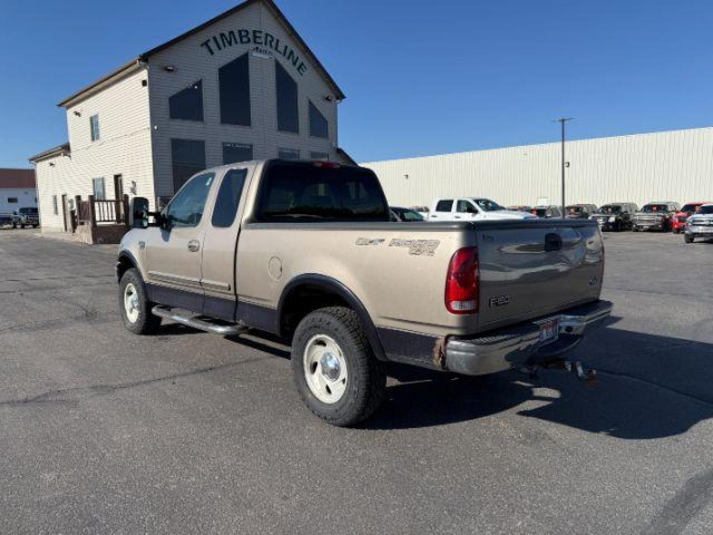 2001 GOLD /CLOTH Ford F-150 XLT SuperCab Short Bed 4WD (1FTRX18L61N) with an 5.4 engine, AUTOMATIC transmission, located at 1235 N Woodruff Ave., Idaho Falls, 83401, (208) 523-1053, 43.507172, -112.000488 - At Timberline Auto, finding a great deal on your next vehicle is always easy! Our experienced sales staff's goal is to help find you the right vehicle at the right price! Our knowledgeable finance department has options for almost any credit score. We offer extended service contract options to prote - Photo#2