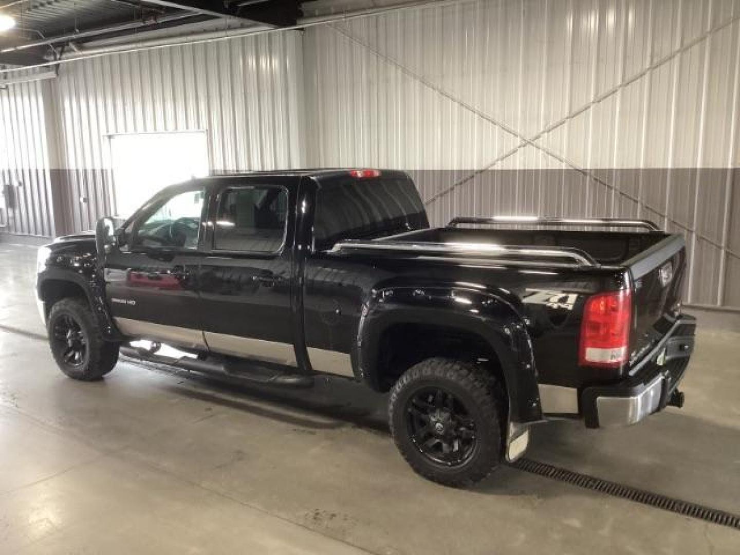 2013 Onyx Black /Ebony Leather Interior GMC Sierra 2500HD SLT Crew Cab 4WD (1GT121E86DF) with an 6.6L V8 OHV 32V TURBO DIESEL engine, 6-Speed Automatic transmission, located at 1235 N Woodruff Ave., Idaho Falls, 83401, (208) 523-1053, 43.507172, -112.000488 - At Timberline Auto, finding a great deal on your next vehicle is always easy! Our experienced sales staff's goal is to help find you the right vehicle at the right price! Our knowledgeable finance department has options for almost any credit score. We offer extended service contract options to prote - Photo#2