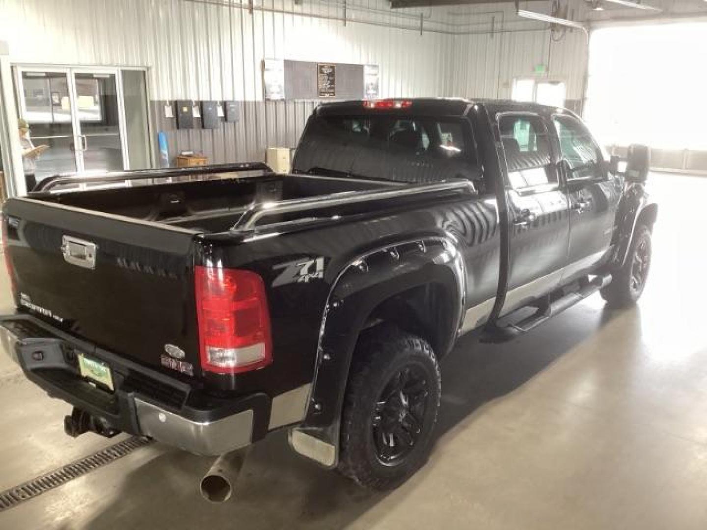 2013 Onyx Black /Ebony Leather Interior GMC Sierra 2500HD SLT Crew Cab 4WD (1GT121E86DF) with an 6.6L V8 OHV 32V TURBO DIESEL engine, 6-Speed Automatic transmission, located at 1235 N Woodruff Ave., Idaho Falls, 83401, (208) 523-1053, 43.507172, -112.000488 - At Timberline Auto, finding a great deal on your next vehicle is always easy! Our experienced sales staff's goal is to help find you the right vehicle at the right price! Our knowledgeable finance department has options for almost any credit score. We offer extended service contract options to prote - Photo#4