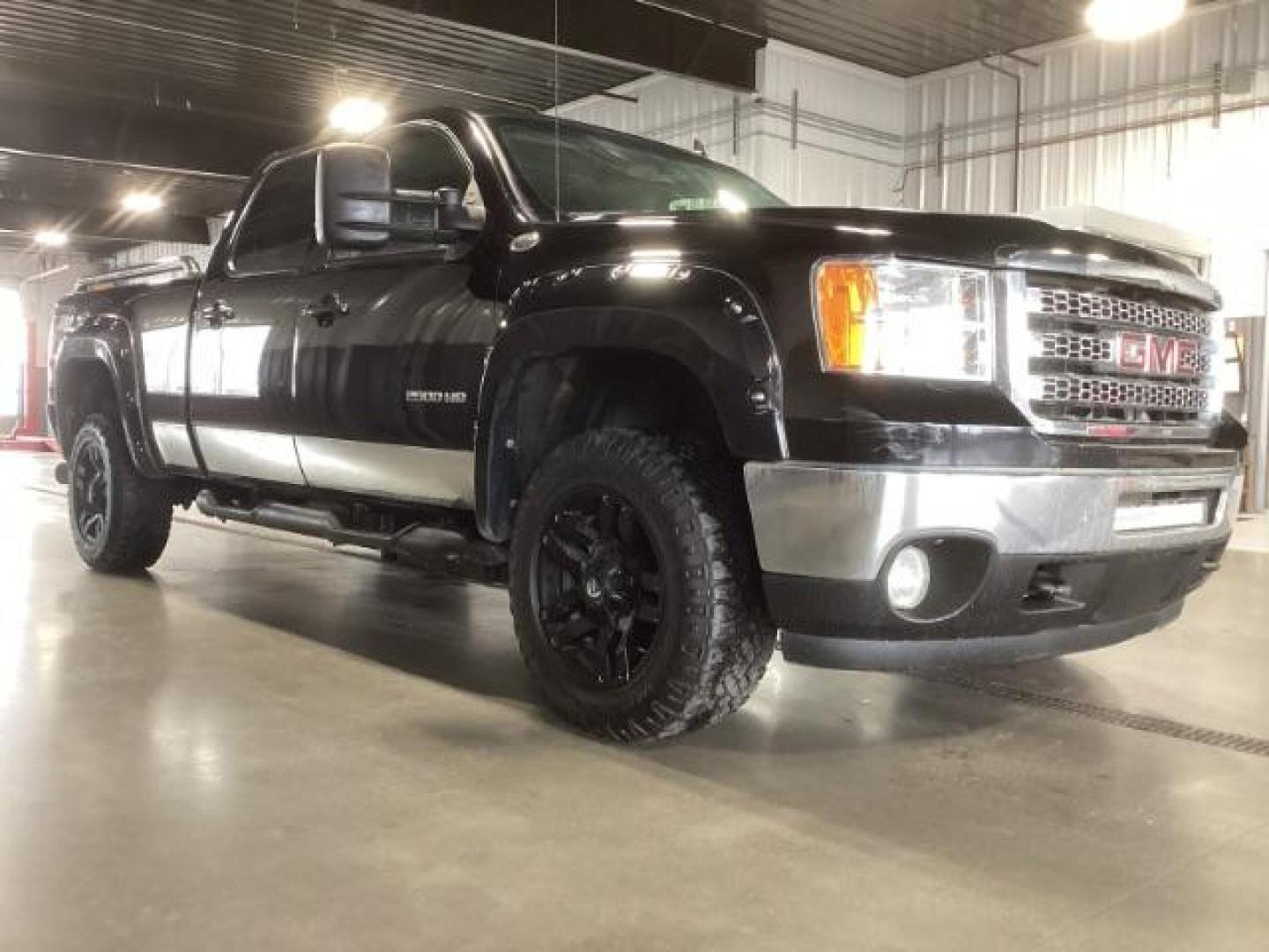 2013 Onyx Black /Ebony Leather Interior GMC Sierra 2500HD SLT Crew Cab 4WD (1GT121E86DF) with an 6.6L V8 OHV 32V TURBO DIESEL engine, 6-Speed Automatic transmission, located at 1235 N Woodruff Ave., Idaho Falls, 83401, (208) 523-1053, 43.507172, -112.000488 - At Timberline Auto, finding a great deal on your next vehicle is always easy! Our experienced sales staff's goal is to help find you the right vehicle at the right price! Our knowledgeable finance department has options for almost any credit score. We offer extended service contract options to prote - Photo#5
