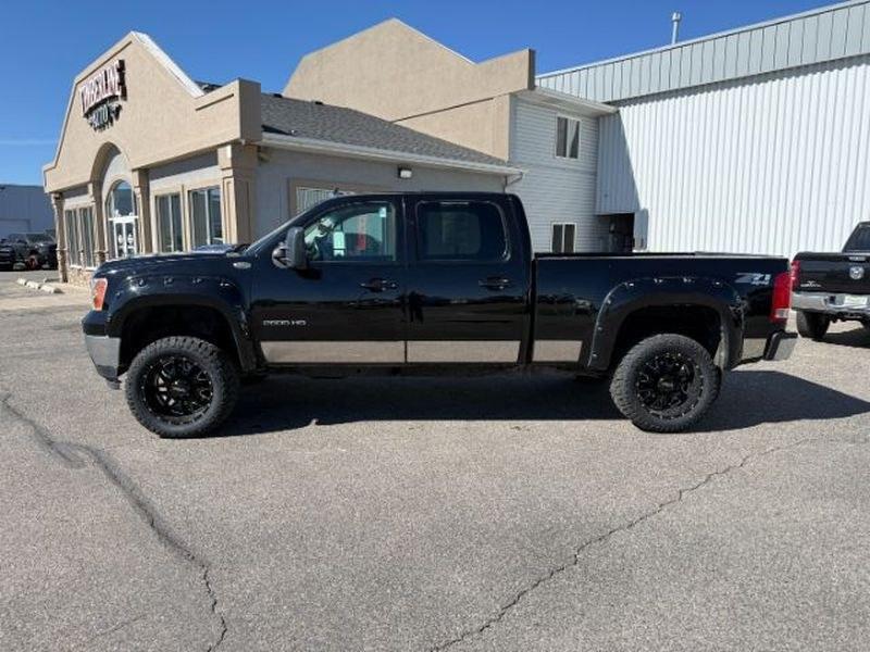 2013 Steel Gray Metallic /Ebony GMC Sierra SLT (1GT121E86DF) with an V8, 6.6L engine, 6-Speed Automatic transmission, located at 1175 N Woodruff Ave, Idaho Falls, ID, 83401, 43.506901, -111.999657 - <b>Vehicle Details</b><br>Looking for a heavy-duty pickup that blends power, comfort, and capability? This pre-owned 2013 GMC Sierra 2500 SLT with 4WD and a V8 6.6L Diesel engine is ready to tackle tough jobs and weekend adventures alike. Built for drivers who need serious towing strength and confid- Photo#1