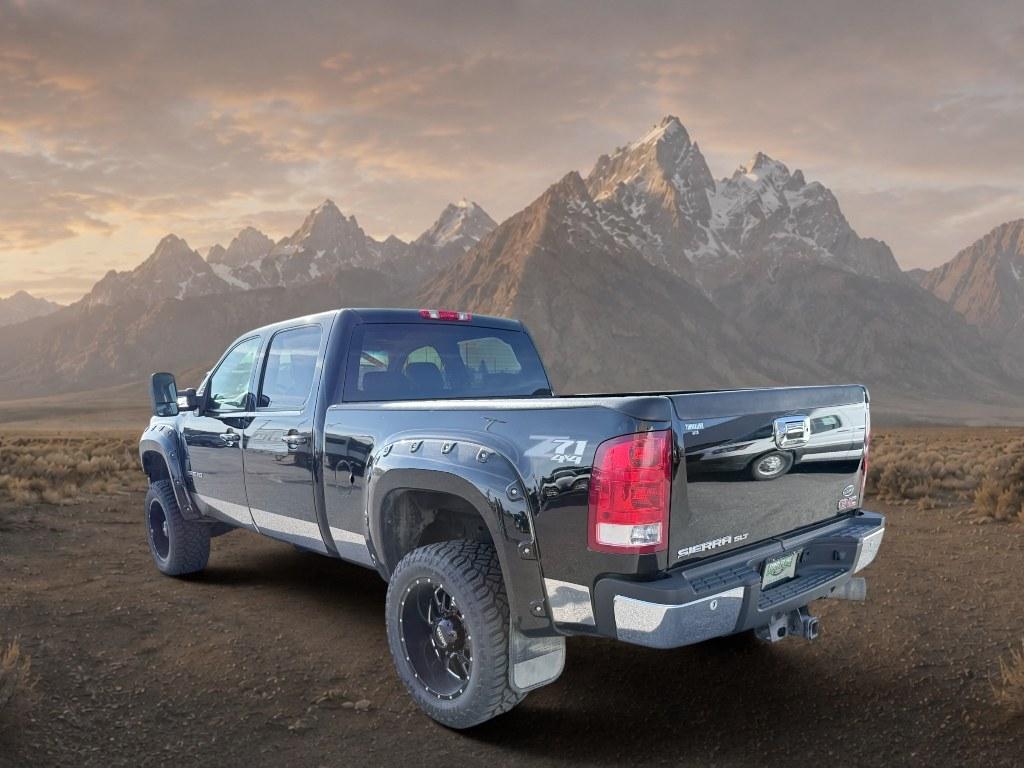 2013 Steel Gray Metallic /Ebony GMC Sierra SLT (1GT121E86DF) with an V8, 6.6L engine, 6-Speed Automatic transmission, located at 1175 N Woodruff Ave, Idaho Falls, ID, 83401, 43.506901, -111.999657 - <b>Vehicle Details</b><br>Looking for a heavy-duty pickup that blends power, comfort, and capability? This pre-owned 2013 GMC Sierra 2500 SLT with 4WD and a V8 6.6L Diesel engine is ready to tackle tough jobs and weekend adventures alike. Built for drivers who need serious towing strength and confid- Photo#1