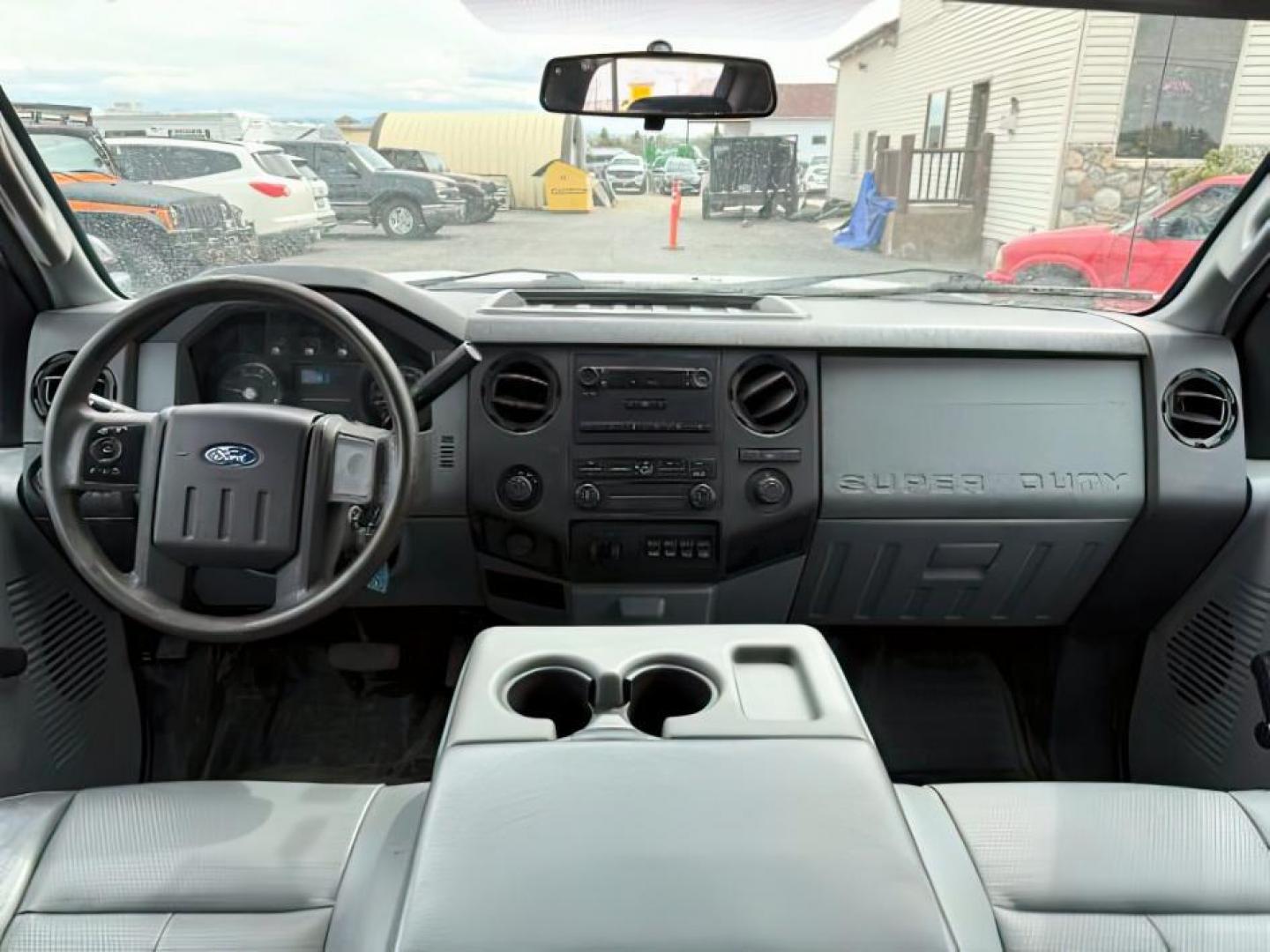 2015 WHITE /CLOTH Ford F-550 Crew Cab DRW 4WD (1FD0W5HT7FE) with an 6.7L V8 OHV 16V DIESEL engine, AUTOMATIC transmission, located at 1235 N Woodruff Ave., Idaho Falls, 83401, (208) 523-1053, 43.507172, -112.000488 - At Timberline Auto, finding a great deal on your next vehicle is always easy! Our experienced sales staff's goal is to help find you the right vehicle at the right price! Our knowledgeable finance department has options for almost any credit score. We offer extended service contract options to prote - Photo#14