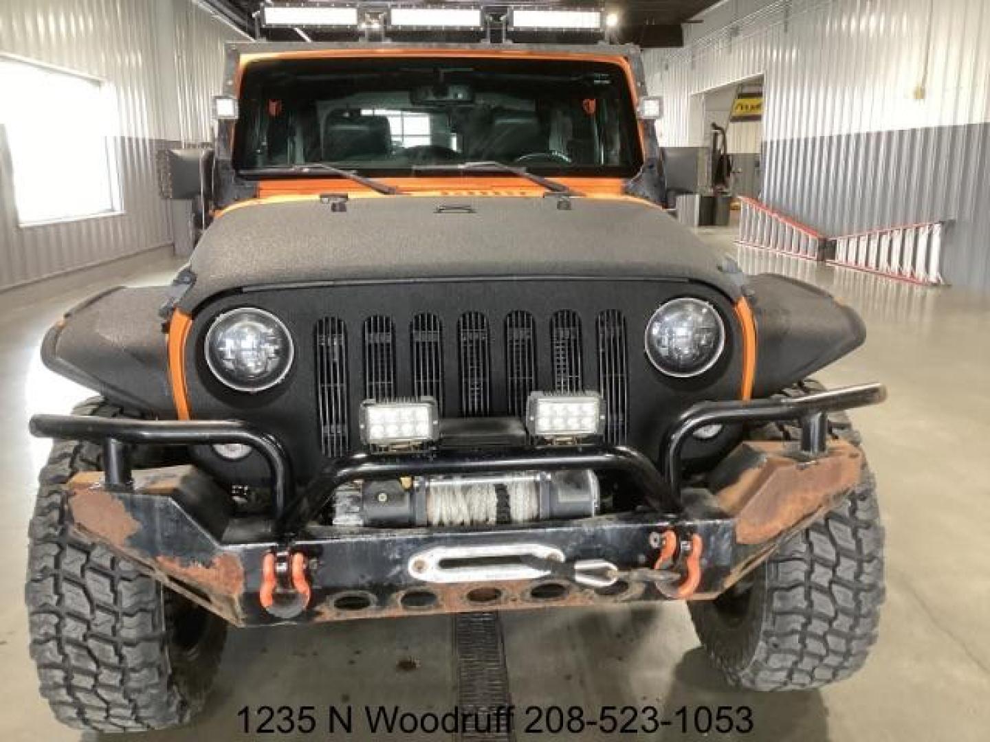 2014 ORANGE /Black Jeep Wrangler Sport 4WD (1C4AJWAG5EL) with an 3.6L V6 DOHC 24V FFV engine, 5-Speed Automatic transmission, located at 1235 N Woodruff Ave., Idaho Falls, 83401, (208) 523-1053, 43.507172, -112.000488 - At Timberline Auto, finding a great deal on your next vehicle is always easy! Our experienced sales staff's goal is to help find you the right vehicle at the right price! Our knowledgeable finance department has options for almost any credit score. We offer extended service contract options to prote - Photo#3