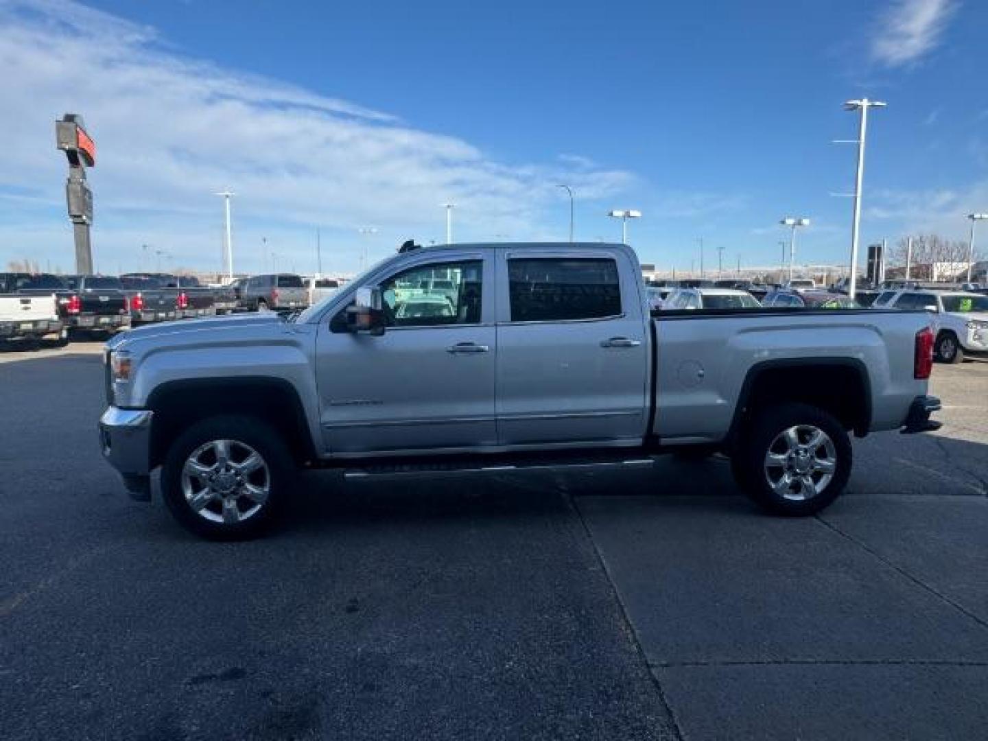 2018 Quicksilver Metallic /Jet Black, leather GMC Sierra 2500HD SLT Crew Cab 4WD (1GT12TEG8JF) with an 6.0L V8 OHV 16V FFV engine, 6-Speed Automatic transmission, located at 1235 N Woodruff Ave., Idaho Falls, 83401, (208) 523-1053, 43.507172, -112.000488 - At Timberline Auto, finding a great deal on your next vehicle is always easy! Our experienced sales staff's goal is to help find you the right vehicle at the right price! Our knowledgeable finance department has options for almost any credit score. We offer extended service contract options to prote - Photo#1