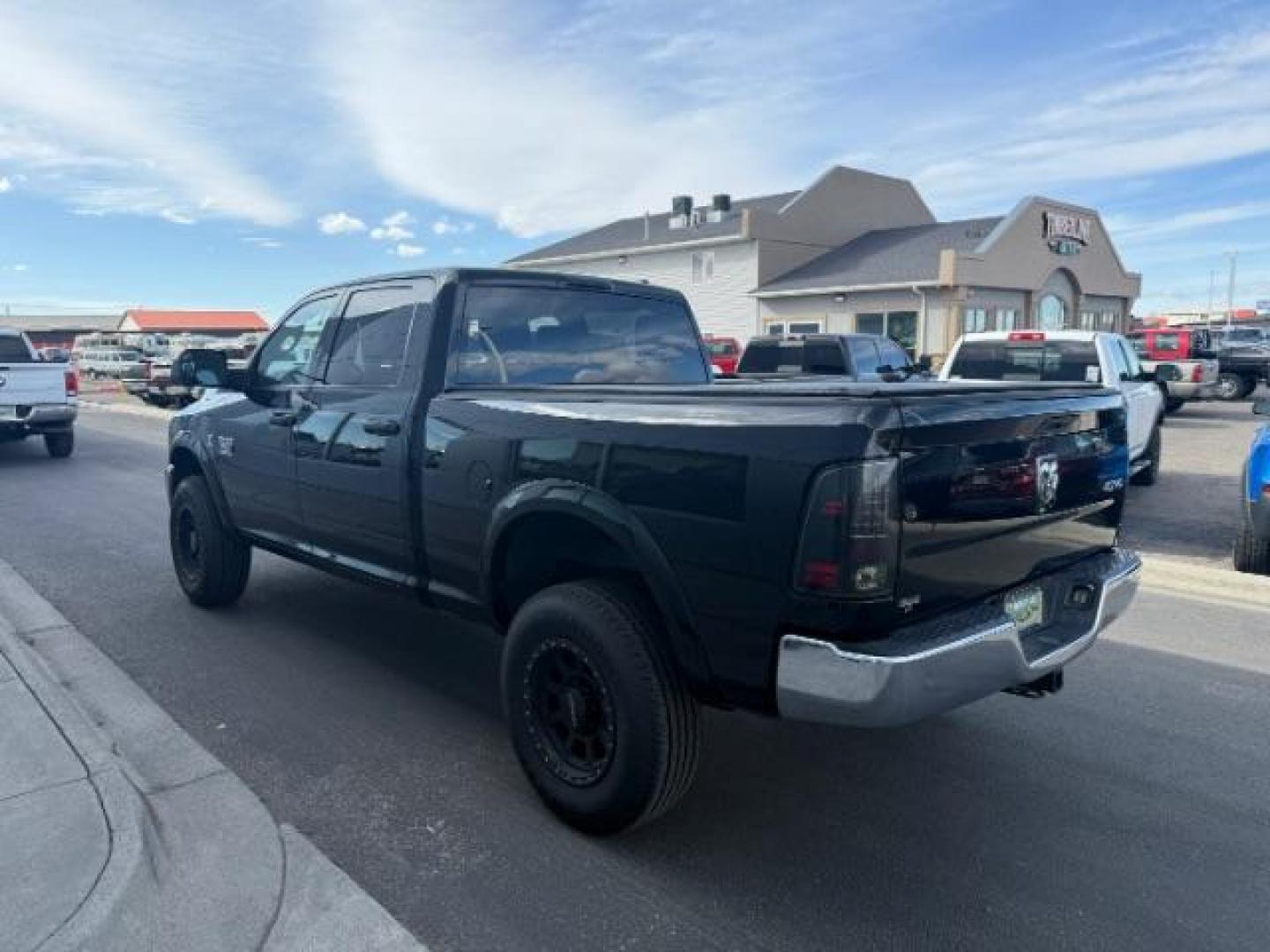 2011 BLACK /Dark Slate/Medium Graystone Cloth Interior RAM 2500 ST Crew Cab LWB 4WD (3D7UT2CL4BG) with an 6.7L L6 OHV 24V TURBO DIESEL engine, 5-Speed Automatic transmission, located at 1235 N Woodruff Ave., Idaho Falls, 83401, (208) 523-1053, 43.507172, -112.000488 - At Timberline Auto, finding a great deal on your next vehicle is always easy! Our experienced sales staff's goal is to help find you the right vehicle at the right price! Our knowledgeable finance department has options for almost any credit score. We offer extended service contract options to prote - Photo#1