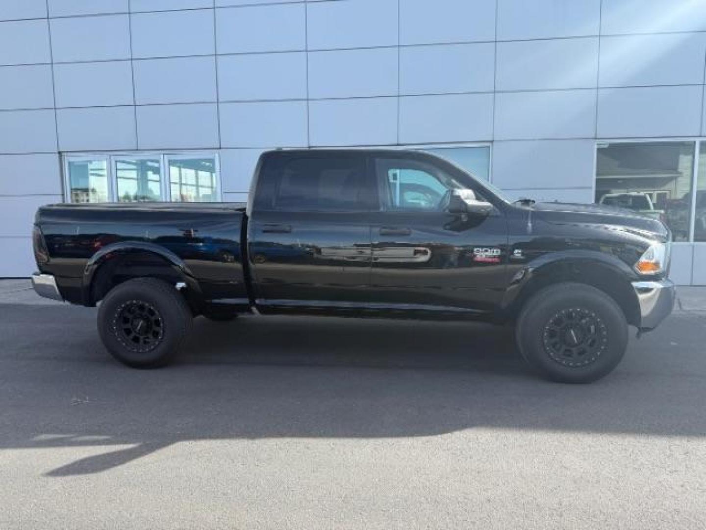 2011 BLACK /Dark Slate/Medium Graystone Cloth Interior RAM 2500 ST Crew Cab LWB 4WD (3D7UT2CL4BG) with an 6.7L L6 OHV 24V TURBO DIESEL engine, 5-Speed Automatic transmission, located at 1235 N Woodruff Ave., Idaho Falls, 83401, (208) 523-1053, 43.507172, -112.000488 - At Timberline Auto, finding a great deal on your next vehicle is always easy! Our experienced sales staff's goal is to help find you the right vehicle at the right price! Our knowledgeable finance department has options for almost any credit score. We offer extended service contract options to prote - Photo#5