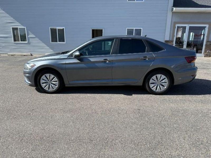 2019 Platinum Gray Metallic /Titan Black Volkswagen Jetta S (3VWN57BU8KM) with an 4 Cyl, 1.4L engine, 6-speed manual transmission, located at 1175 N Woodruff Ave, Idaho Falls, ID, 83401, 43.506901, -111.999657 - <b>Vehicle Details</b><br>Looking for a stylish, dependable compact sedan in Idaho Falls, ID? This pre-owned 2019 Volkswagen Jetta S brings sharp styling, confident Front-Wheel Drive, and a responsive 4-cylinder 1.4L gasoline engine that makes every commute feel smooth and composed. Inside, you'll f- Photo#1