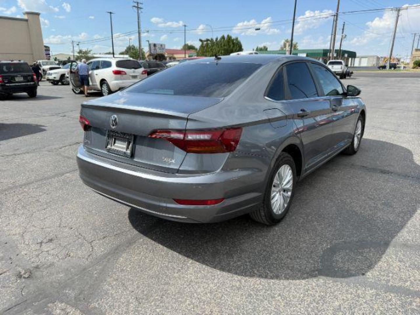 2019 Platinum Gray Metallic /Titan Black Volkswagen Jetta (3VWN57BU8KM) with an 14L I-4 gasoline direct injection engine, Manual transmission, located at 1175 N Woodruff Ave, Idaho Falls, ID, 83401, 43.506901, -111.999657 - At Timberline Auto, finding a great deal on your next vehicle is always easy! Our experienced sales staff's goal is to help find you the right vehicle at the right price! Our knowledgeable finance department has options for almost any credit score. We offer extended service contract options to prote - Photo#4