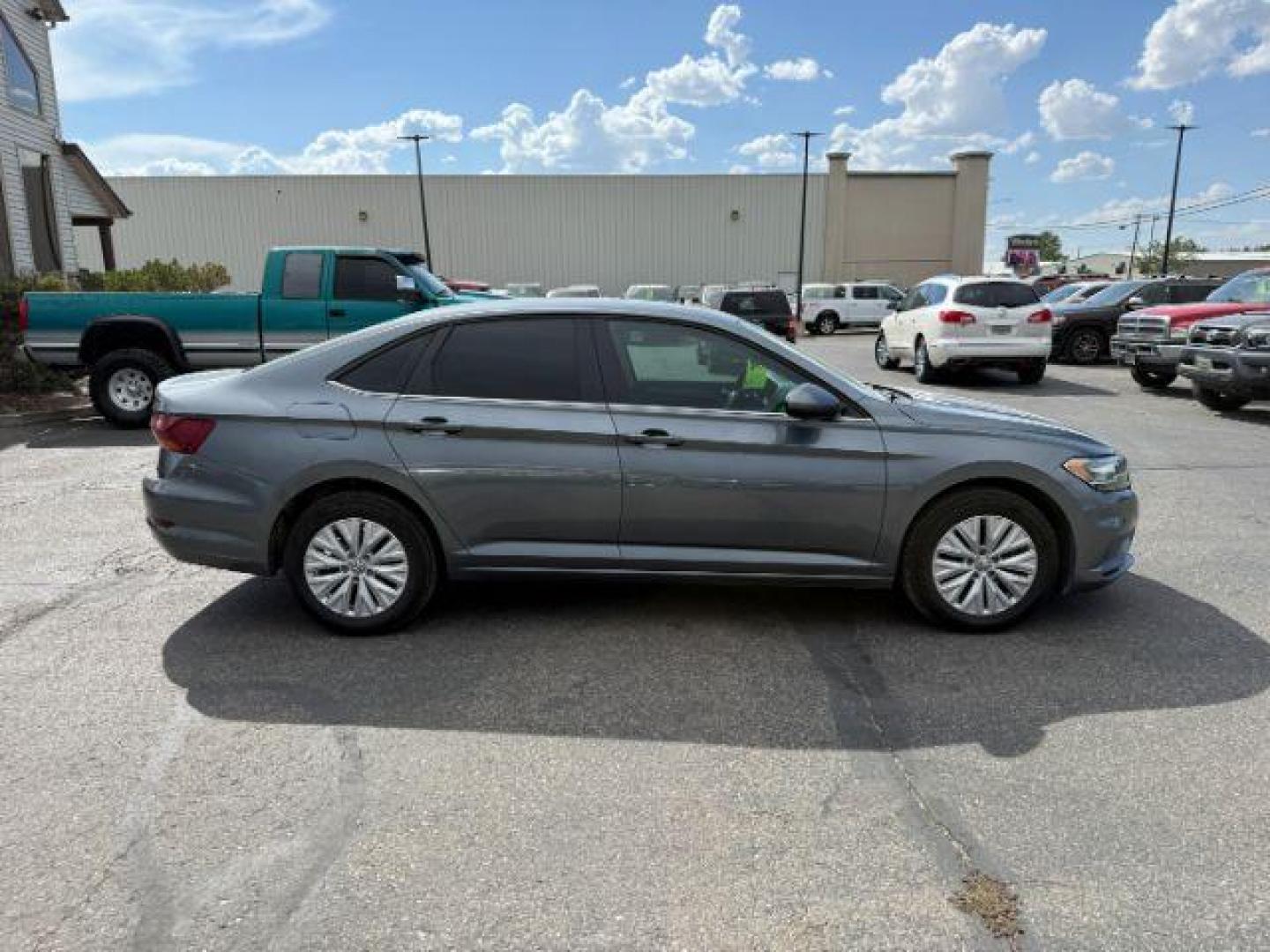 2019 Platinum Gray Metallic /Titan Black Volkswagen Jetta (3VWN57BU8KM) with an 14L I-4 gasoline direct injection engine, Manual transmission, located at 1175 N Woodruff Ave, Idaho Falls, ID, 83401, 43.506901, -111.999657 - At Timberline Auto, finding a great deal on your next vehicle is always easy! Our experienced sales staff's goal is to help find you the right vehicle at the right price! Our knowledgeable finance department has options for almost any credit score. We offer extended service contract options to prote - Photo#5