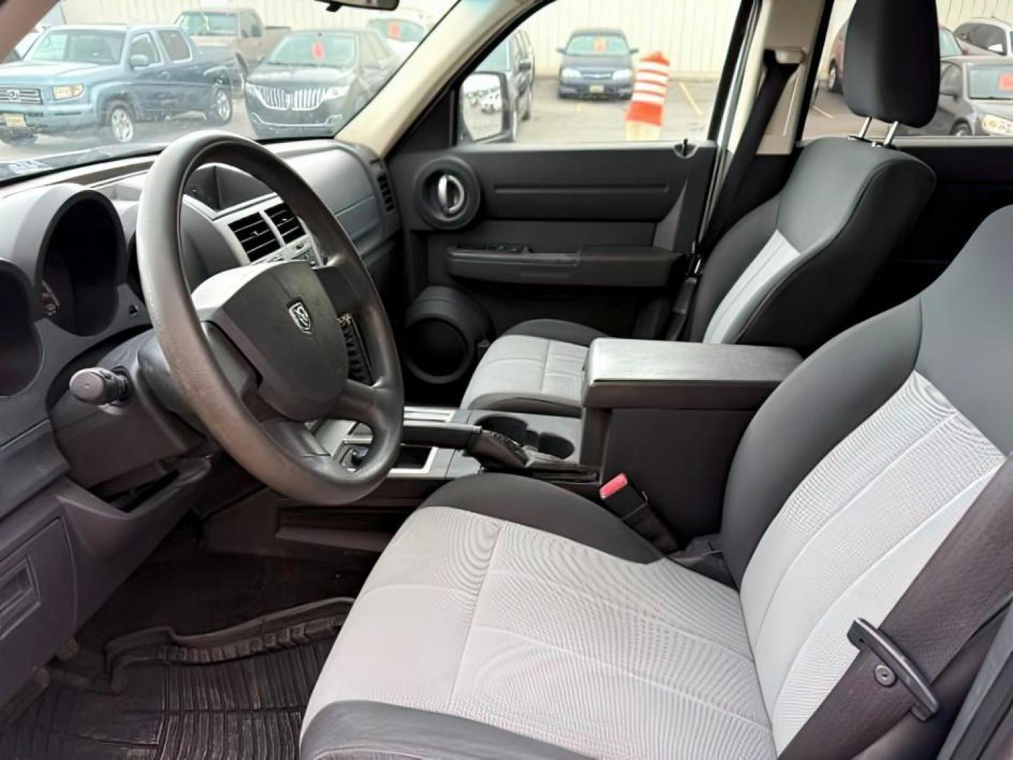 2008 Stone White Clearcoat /Dark Slate Grey Dodge Nitro SE/SXT (1D8GU28K58W) with an Magnum 3.7L V-6 regular unleaded engine, AUTOMATIC transmission, located at 1235 N Woodruff Ave., Idaho Falls, 83401, (208) 523-1053, 43.507172, -112.000488 - At Timberline Auto, finding a great deal on your next vehicle is always easy! Our experienced sales staff's goal is to help find you the right vehicle at the right price! Our knowledgeable finance department has options for almost any credit score. We offer extended service contract options to prote - Photo#9