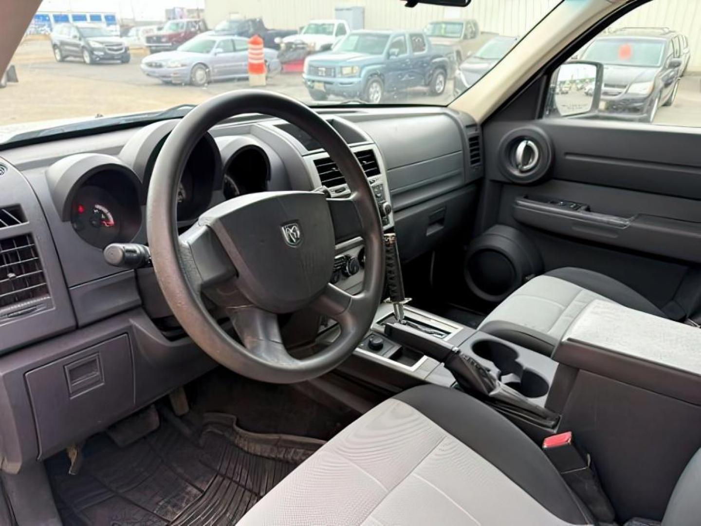 2008 Stone White Clearcoat /Dark Slate Grey Dodge Nitro SE/SXT (1D8GU28K58W) with an Magnum 3.7L V-6 regular unleaded engine, AUTOMATIC transmission, located at 1235 N Woodruff Ave., Idaho Falls, 83401, (208) 523-1053, 43.507172, -112.000488 - At Timberline Auto, finding a great deal on your next vehicle is always easy! Our experienced sales staff's goal is to help find you the right vehicle at the right price! Our knowledgeable finance department has options for almost any credit score. We offer extended service contract options to prote - Photo#10