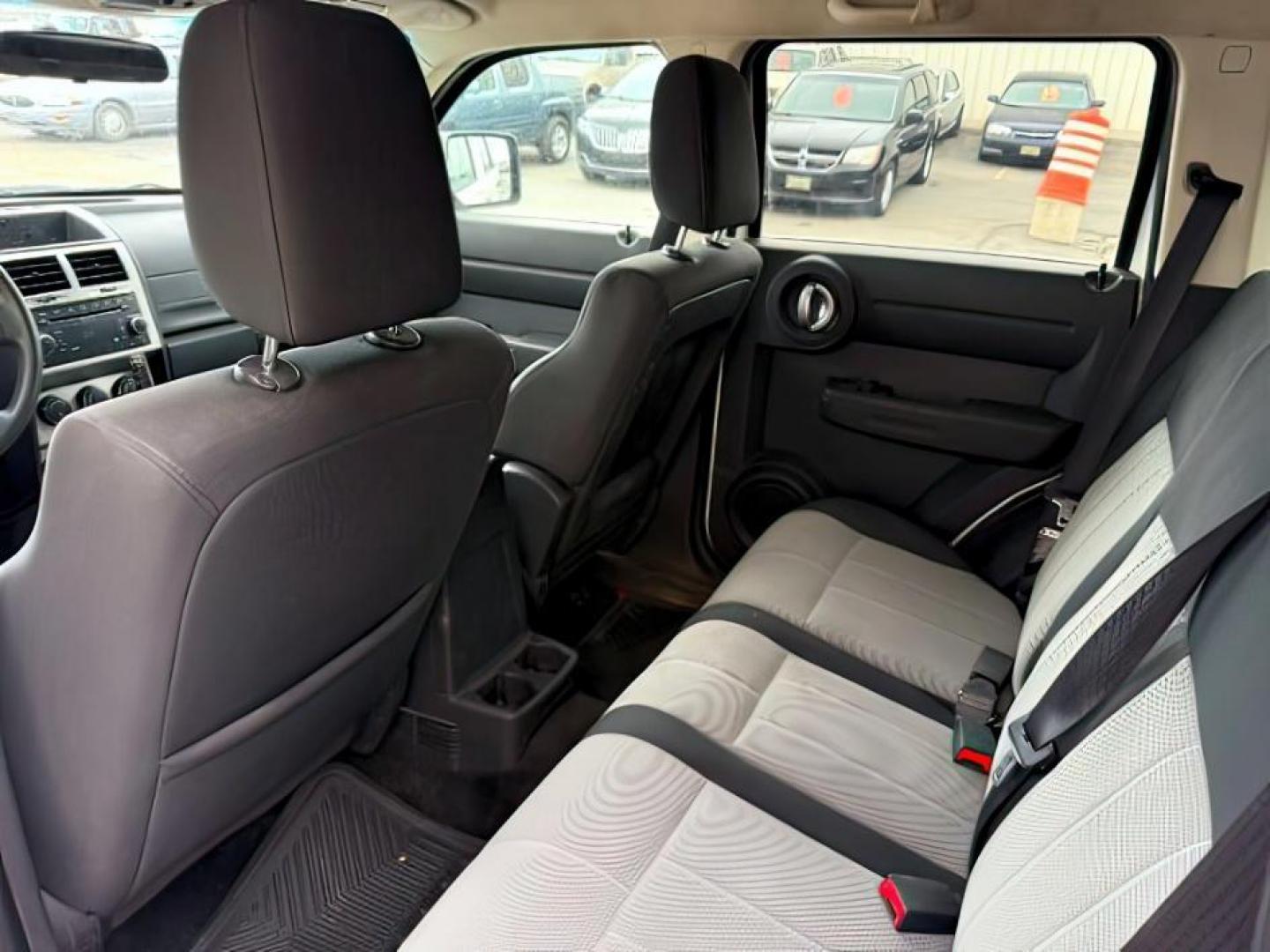 2008 Stone White Clearcoat /Dark Slate Grey Dodge Nitro SE/SXT (1D8GU28K58W) with an Magnum 3.7L V-6 regular unleaded engine, AUTOMATIC transmission, located at 1235 N Woodruff Ave., Idaho Falls, 83401, (208) 523-1053, 43.507172, -112.000488 - At Timberline Auto, finding a great deal on your next vehicle is always easy! Our experienced sales staff's goal is to help find you the right vehicle at the right price! Our knowledgeable finance department has options for almost any credit score. We offer extended service contract options to prote - Photo#16