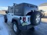 2015 WHITE /BLACK JEEP WRANGLER UNLIMITED SPORT (1C4BJWDG2FL) with an V-6 engine, AUTO transmission, located at 1235 N Woodruff Ave., Idaho Falls, 83401, (208) 523-1053, 43.507172, -112.000488 - Photo#1