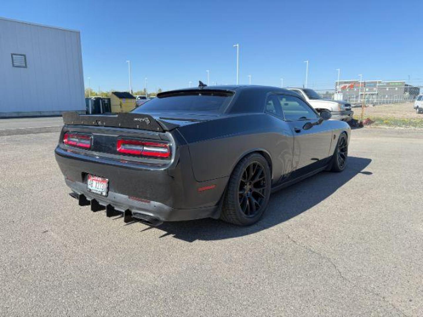 2015 Pitch Black Clearcoat /Black/Ruby Red Dodge Challenger Supercharged (2C3CDZC9XFH) with an 6.2L V8 OHV 16V SUPERCHARGED engine, 6-Speed Manual transmission, located at 1235 N Woodruff Ave., Idaho Falls, 83401, (208) 523-1053, 43.507172, -112.000488 - At Timberline Auto, finding a great deal on your next vehicle is always easy! Our experienced sales staff's goal is to help find you the right vehicle at the right price! Our knowledgeable finance department has options for almost any credit score. We offer extended service contract options to prote - Photo#3