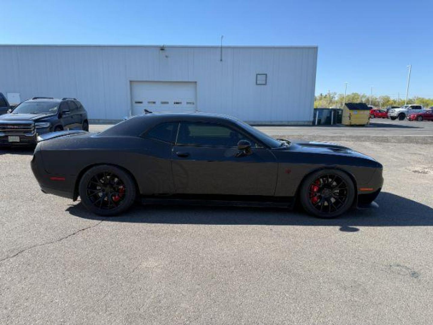 2015 Pitch Black Clearcoat /Black/Ruby Red Dodge Challenger Supercharged (2C3CDZC9XFH) with an 6.2L V8 OHV 16V SUPERCHARGED engine, 6-Speed Manual transmission, located at 1235 N Woodruff Ave., Idaho Falls, 83401, (208) 523-1053, 43.507172, -112.000488 - At Timberline Auto, finding a great deal on your next vehicle is always easy! Our experienced sales staff's goal is to help find you the right vehicle at the right price! Our knowledgeable finance department has options for almost any credit score. We offer extended service contract options to prote - Photo#4