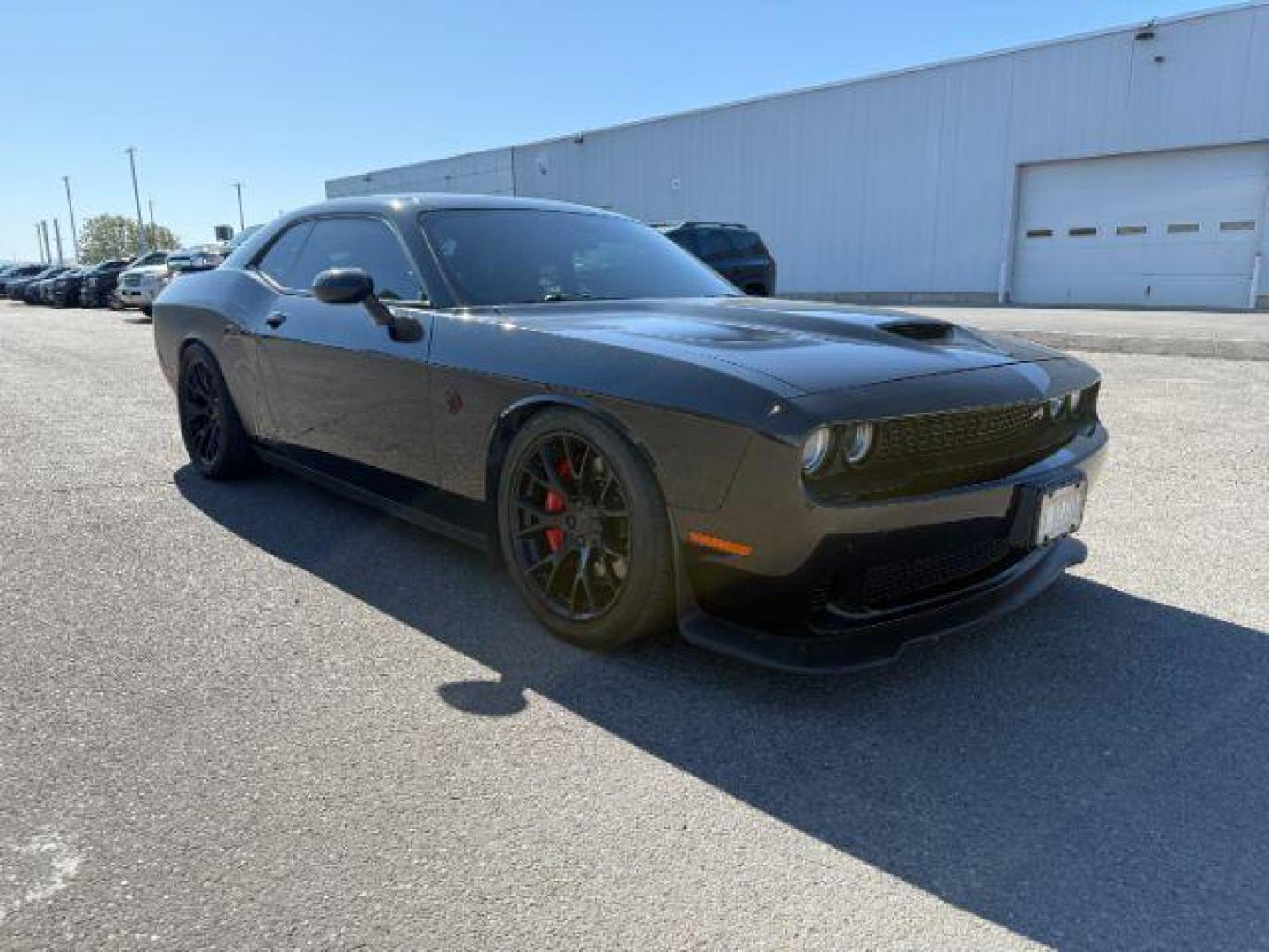 2015 Pitch Black Clearcoat /Black/Ruby Red Dodge Challenger Supercharged (2C3CDZC9XFH) with an 6.2L V8 OHV 16V SUPERCHARGED engine, 6-Speed Manual transmission, located at 1235 N Woodruff Ave., Idaho Falls, 83401, (208) 523-1053, 43.507172, -112.000488 - At Timberline Auto, finding a great deal on your next vehicle is always easy! Our experienced sales staff's goal is to help find you the right vehicle at the right price! Our knowledgeable finance department has options for almost any credit score. We offer extended service contract options to prote - Photo#5