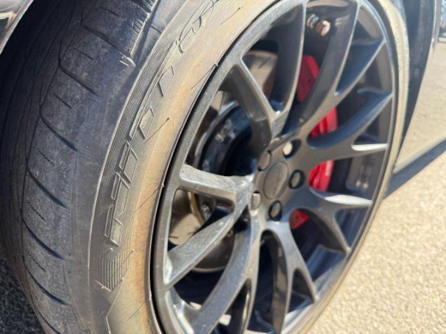 2015 Pitch Black Clearcoat /Black/Ruby Red Dodge Challenger Supercharged (2C3CDZC9XFH) with an 6.2L V8 OHV 16V SUPERCHARGED engine, 6-Speed Manual transmission, located at 1235 N Woodruff Ave., Idaho Falls, 83401, (208) 523-1053, 43.507172, -112.000488 - At Timberline Auto, finding a great deal on your next vehicle is always easy! Our experienced sales staff's goal is to help find you the right vehicle at the right price! Our knowledgeable finance department has options for almost any credit score. We offer extended service contract options to prote - Photo#7
