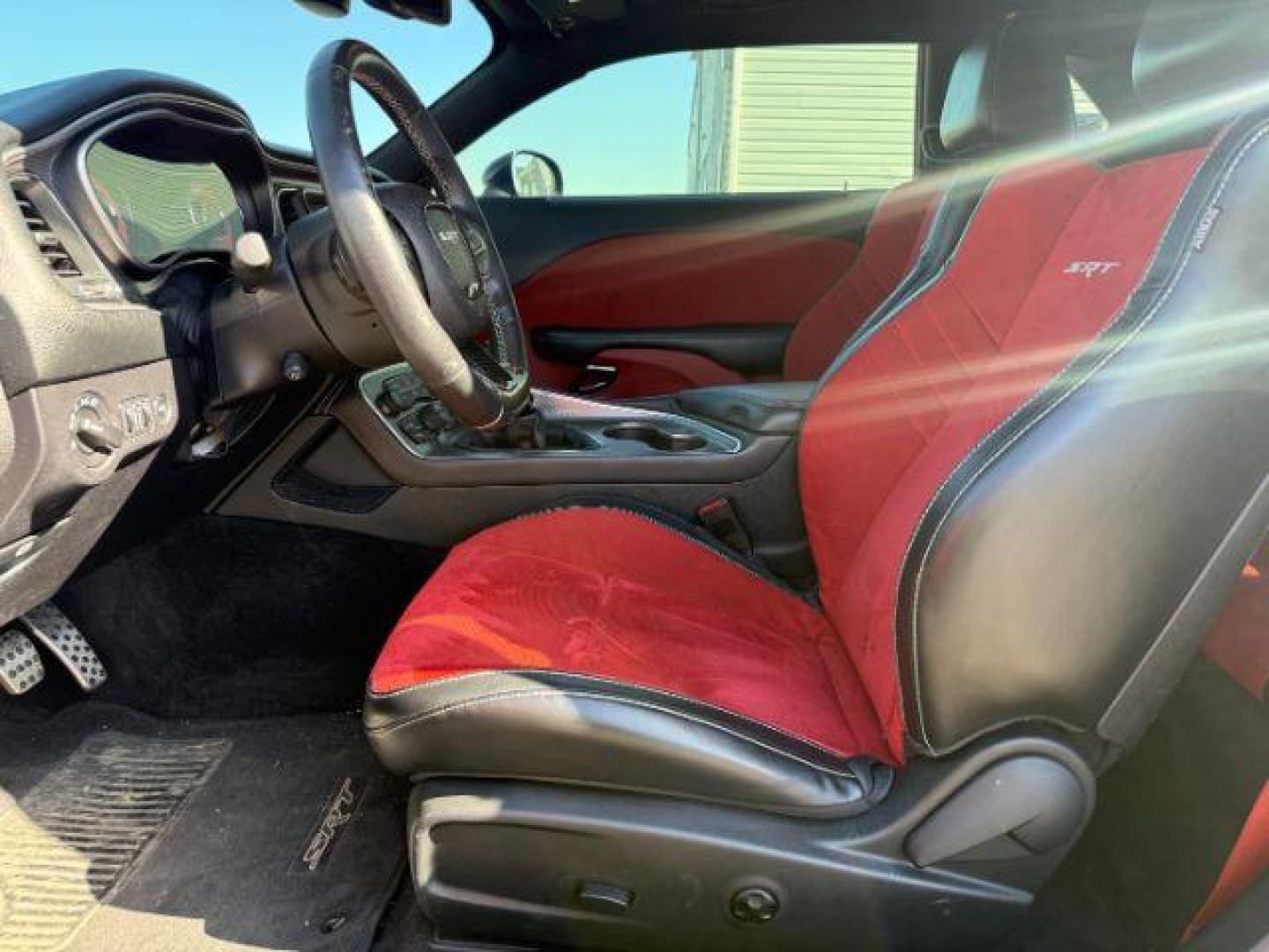 2015 Pitch Black Clearcoat /Black/Ruby Red Dodge Challenger Supercharged (2C3CDZC9XFH) with an 6.2L V8 OHV 16V SUPERCHARGED engine, 6-Speed Manual transmission, located at 1235 N Woodruff Ave., Idaho Falls, 83401, (208) 523-1053, 43.507172, -112.000488 - At Timberline Auto, finding a great deal on your next vehicle is always easy! Our experienced sales staff's goal is to help find you the right vehicle at the right price! Our knowledgeable finance department has options for almost any credit score. We offer extended service contract options to prote - Photo#8
