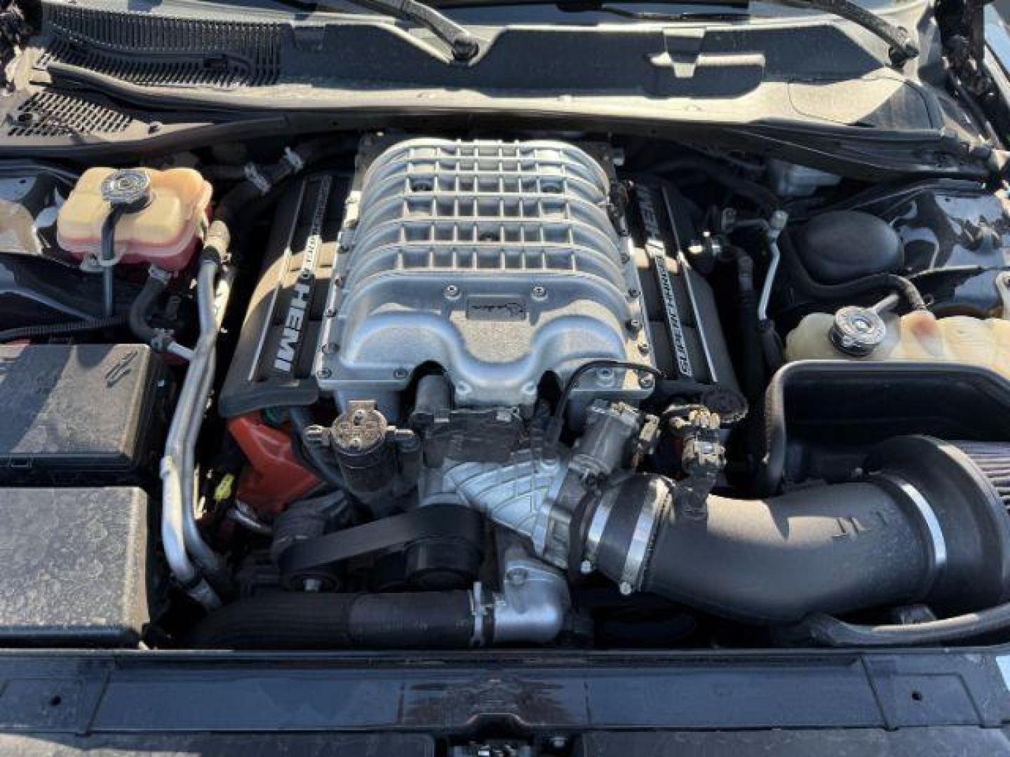 2015 Pitch Black Clearcoat /Black/Ruby Red Dodge Challenger Supercharged (2C3CDZC9XFH) with an 6.2L V8 OHV 16V SUPERCHARGED engine, 6-Speed Manual transmission, located at 1235 N Woodruff Ave., Idaho Falls, 83401, (208) 523-1053, 43.507172, -112.000488 - At Timberline Auto, finding a great deal on your next vehicle is always easy! Our experienced sales staff's goal is to help find you the right vehicle at the right price! Our knowledgeable finance department has options for almost any credit score. We offer extended service contract options to prote - Photo#18