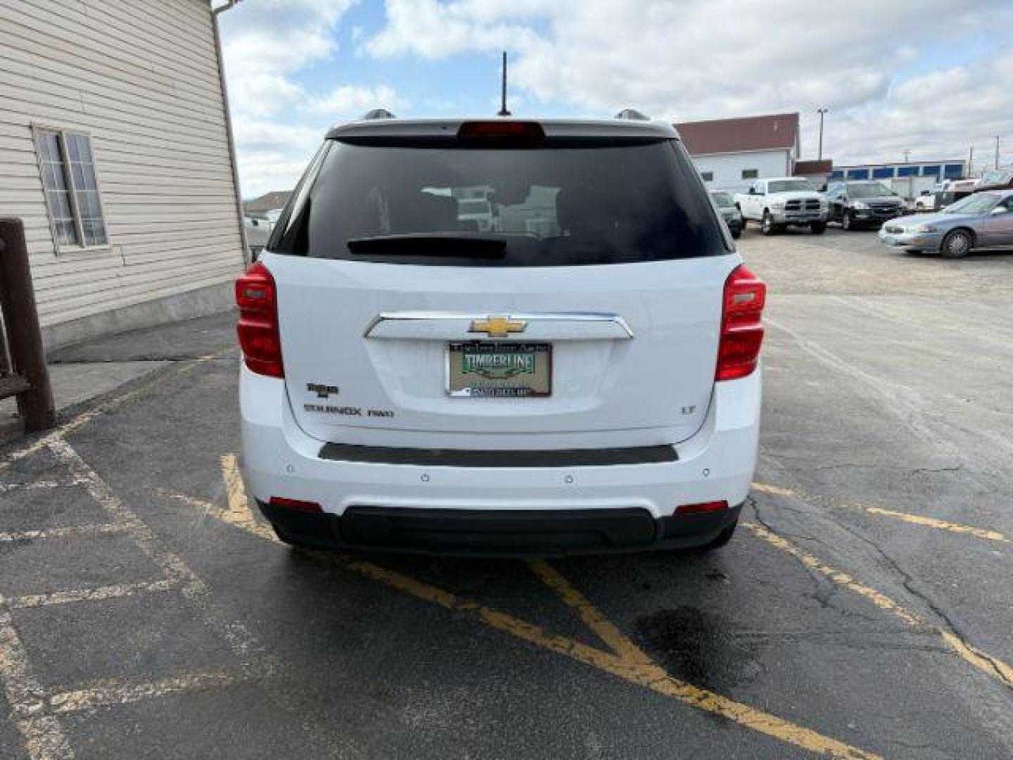 2017 Summit White /Jet Black Chevrolet Equinox LT (2GNFLFEK2H6) with an 2.4L I-4 gasoline direct injection engine, located at 1235 N Woodruff Ave., Idaho Falls, 83401, (208) 523-1053, 43.507172, -112.000488 - At Timberline Auto, finding a great deal on your next vehicle is always easy! Our experienced sales staff's goal is to help find you the right vehicle at the right price! Our knowledgeable finance department has options for almost any credit score. We offer extended service contract options to prote - Photo#2