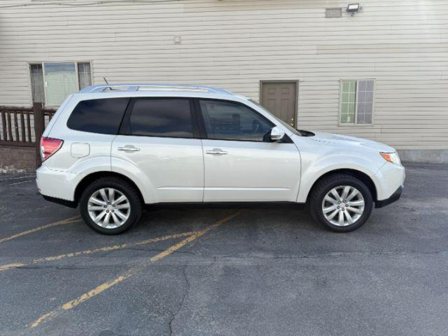 2012 Satin White Pearl /Black Leather Interior Subaru Forester 2.5X Touring (JF2SHAGC0CH) with an 2.5L H4 SOHC 16V engine, 4-Speed Automatic transmission, located at 1235 N Woodruff Ave., Idaho Falls, 83401, (208) 523-1053, 43.507172, -112.000488 - Photo#4