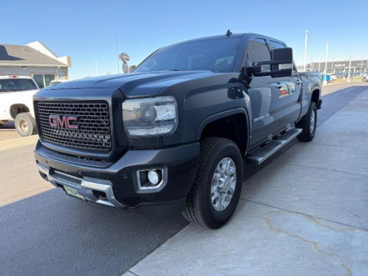 2015 Onyx Black /Jet Black GMC Sierra 2500HD Denali (1GT120E84FF) with an Duramax 6.6L V-8 diesel direct injection engine, AUTOMATIC transmission, located at 1235 N Woodruff Ave., Idaho Falls, 83401, (208) 523-1053, 43.507172, -112.000488 - At Timberline Auto, finding a great deal on your next vehicle is always easy! Our experienced sales staff's goal is to help find you the right vehicle at the right price! Our knowledgeable finance department has options for almost any credit score. We offer extended service contract options to prote - Photo#0