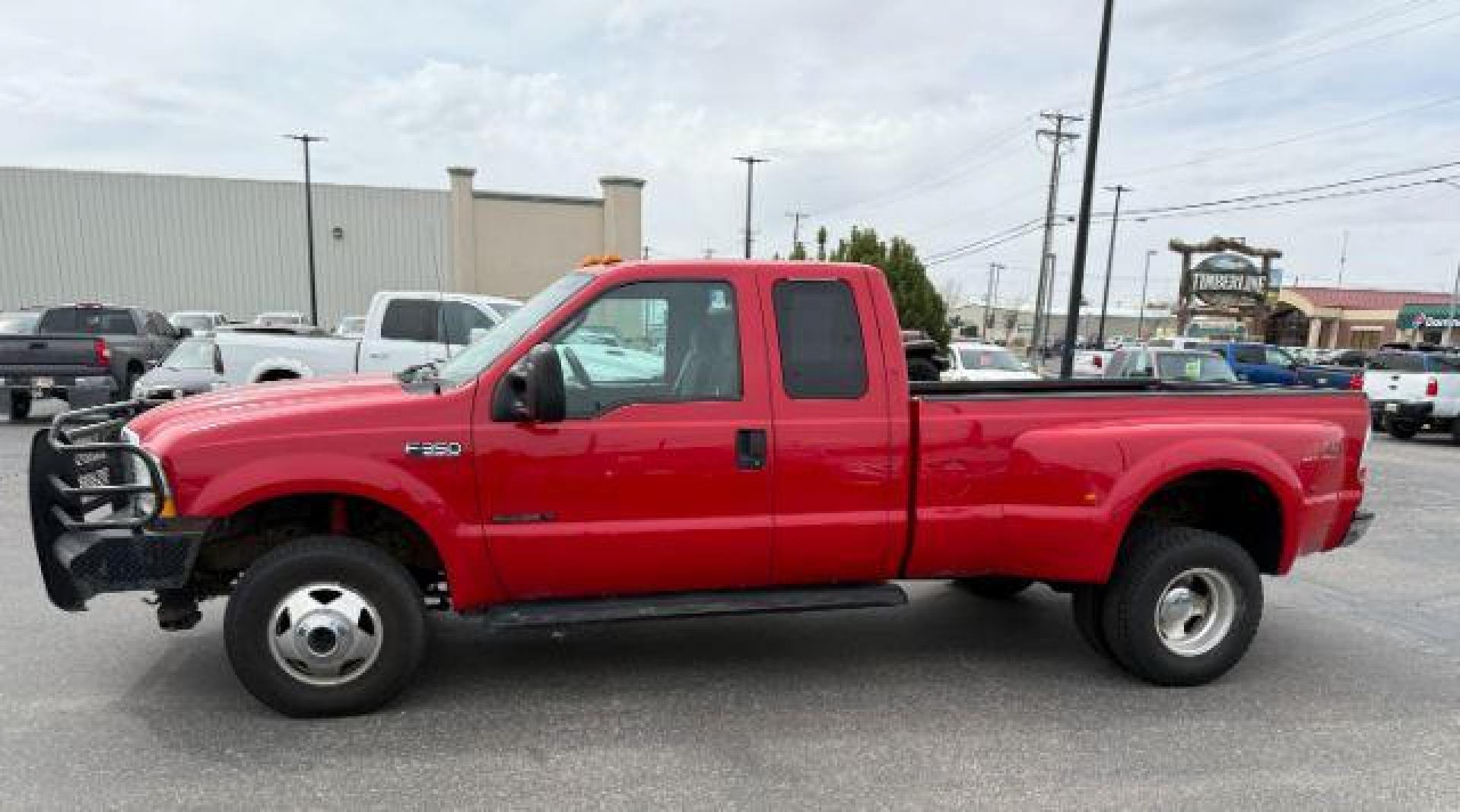 2003 Red Clearcoat /Medium Flint Ford F-350 XLT (1FTWX33F73E) with an Powerstroke 6L V-8 diesel direct injection engine, AUTOMATIC transmission, located at 1235 N Woodruff Ave., Idaho Falls, 83401, (208) 523-1053, 43.507172, -112.000488 - At Timberline Auto, finding a great deal on your next vehicle is always easy! Our experienced sales staff's goal is to help find you the right vehicle at the right price! Our knowledgeable finance department has options for almost any credit score. We offer extended service contract options to prote - Photo#1