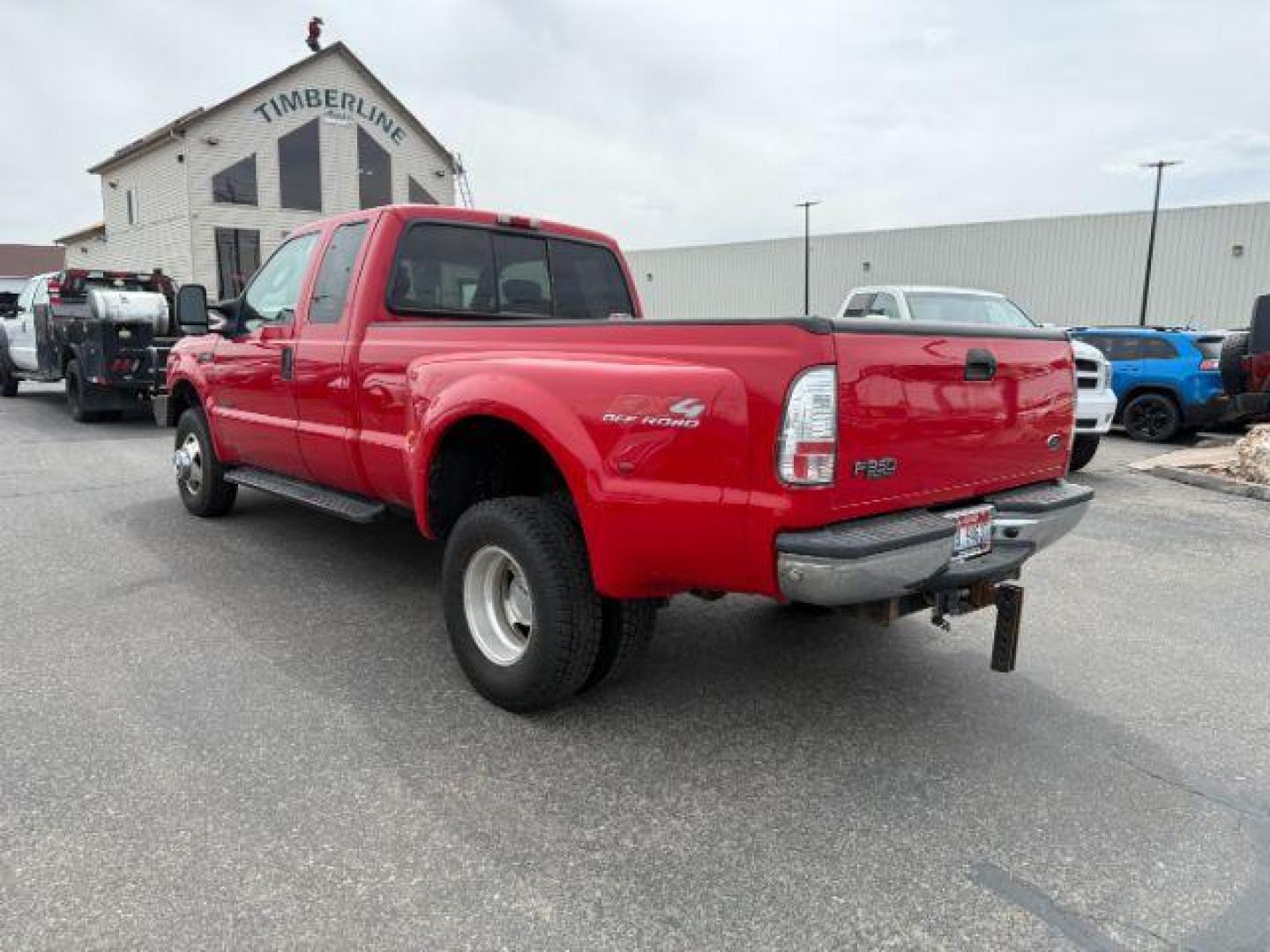 2003 Red Clearcoat /Medium Flint Ford F-350 XLT (1FTWX33F73E) with an Powerstroke 6L V-8 diesel direct injection engine, AUTOMATIC transmission, located at 1235 N Woodruff Ave., Idaho Falls, 83401, (208) 523-1053, 43.507172, -112.000488 - At Timberline Auto, finding a great deal on your next vehicle is always easy! Our experienced sales staff's goal is to help find you the right vehicle at the right price! Our knowledgeable finance department has options for almost any credit score. We offer extended service contract options to prote - Photo#2
