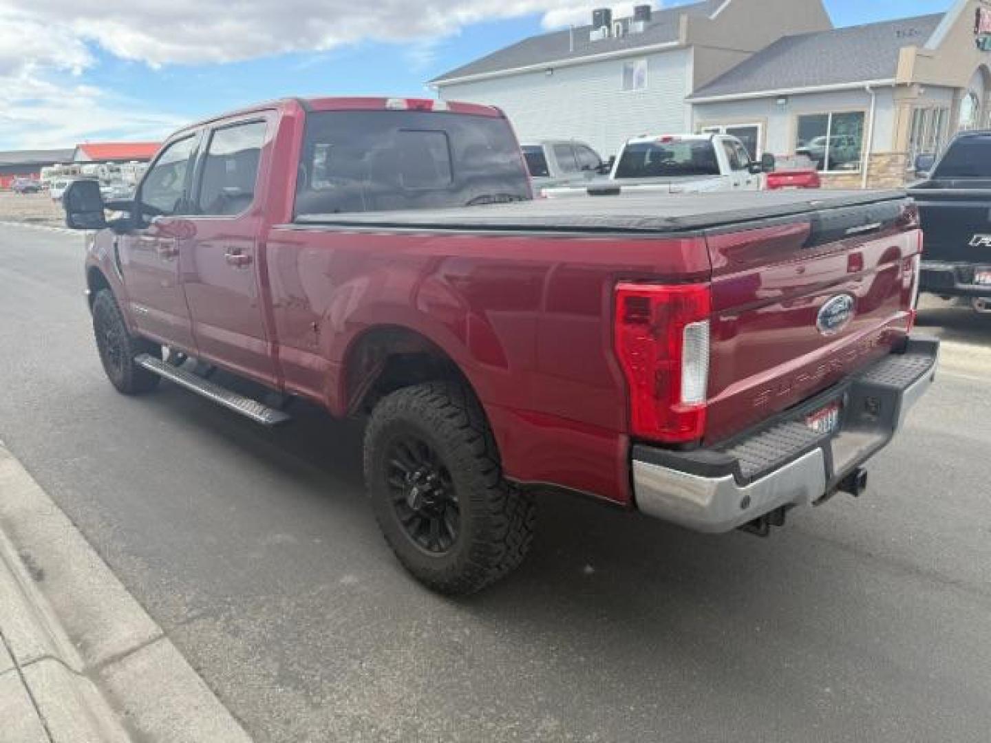 2017 Ruby Red Metallic Tinted Clearcoat /Black Ford F-350 LARIAT (1FT8W3BT6HE) with an 6.7 engine, AUTOMATIC transmission, located at 1235 N Woodruff Ave., Idaho Falls, 83401, (208) 523-1053, 43.507172, -112.000488 - At Timberline Auto, finding a great deal on your next vehicle is always easy! Our experienced sales staff's goal is to help find you the right vehicle at the right price! Our knowledgeable finance department has options for almost any credit score. We offer extended service contract options to prote - Photo#6