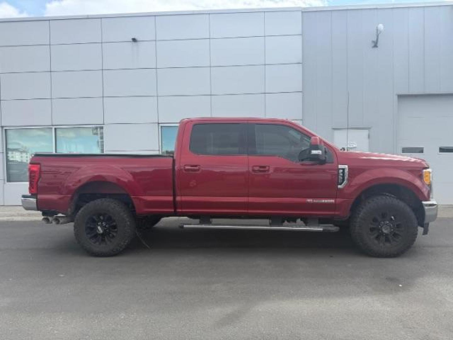 2017 Ruby Red Metallic Tinted Clearcoat /Black Ford F-350 LARIAT (1FT8W3BT6HE) with an 6.7 engine, AUTOMATIC transmission, located at 1235 N Woodruff Ave., Idaho Falls, 83401, (208) 523-1053, 43.507172, -112.000488 - At Timberline Auto, finding a great deal on your next vehicle is always easy! Our experienced sales staff's goal is to help find you the right vehicle at the right price! Our knowledgeable finance department has options for almost any credit score. We offer extended service contract options to prote - Photo#3