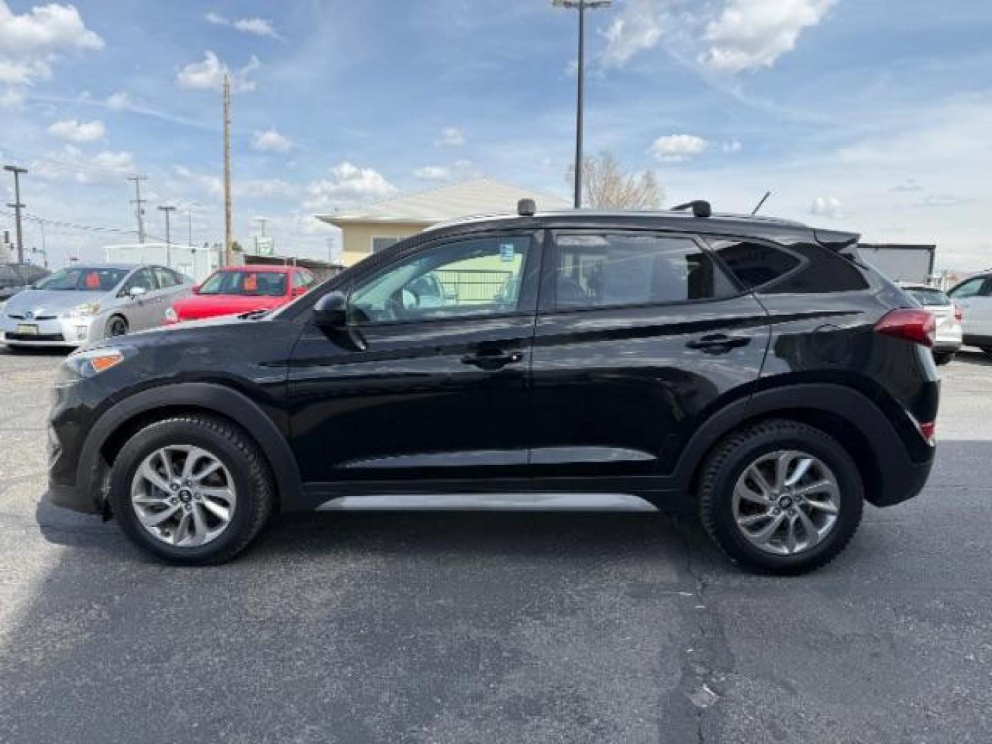 2017 Black Noir Pearl /Gray Hyundai Tucson SE (KM8J33A42HU) with an Nu 2L I-4 gasoline direct injection engine, AUTOMATIC transmission, located at 1235 N Woodruff Ave., Idaho Falls, 83401, (208) 523-1053, 43.507172, -112.000488 - At Timberline Auto, finding a great deal on your next vehicle is always easy! Our experienced sales staff's goal is to help find you the right vehicle at the right price! Our knowledgeable finance department has options for almost any credit score. We offer extended service contract options to prote - Photo#1