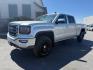 2018 Quicksilver Metallic /Jet Black GMC Sierra 1500 SLE (3GTU2MEC6JG) with an EcoTec3 4.3L V-6 gasoline direct injection engine, AUTOMATIC transmission, located at 1235 N Woodruff Ave., Idaho Falls, 83401, (208) 523-1053, 43.507172, -112.000488 - At Timberline Auto, finding a great deal on your next vehicle is always easy! Our experienced sales staff's goal is to help find you the right vehicle at the right price! Our knowledgeable finance department has options for almost any credit score. We offer extended service contract options to prote - Photo#0